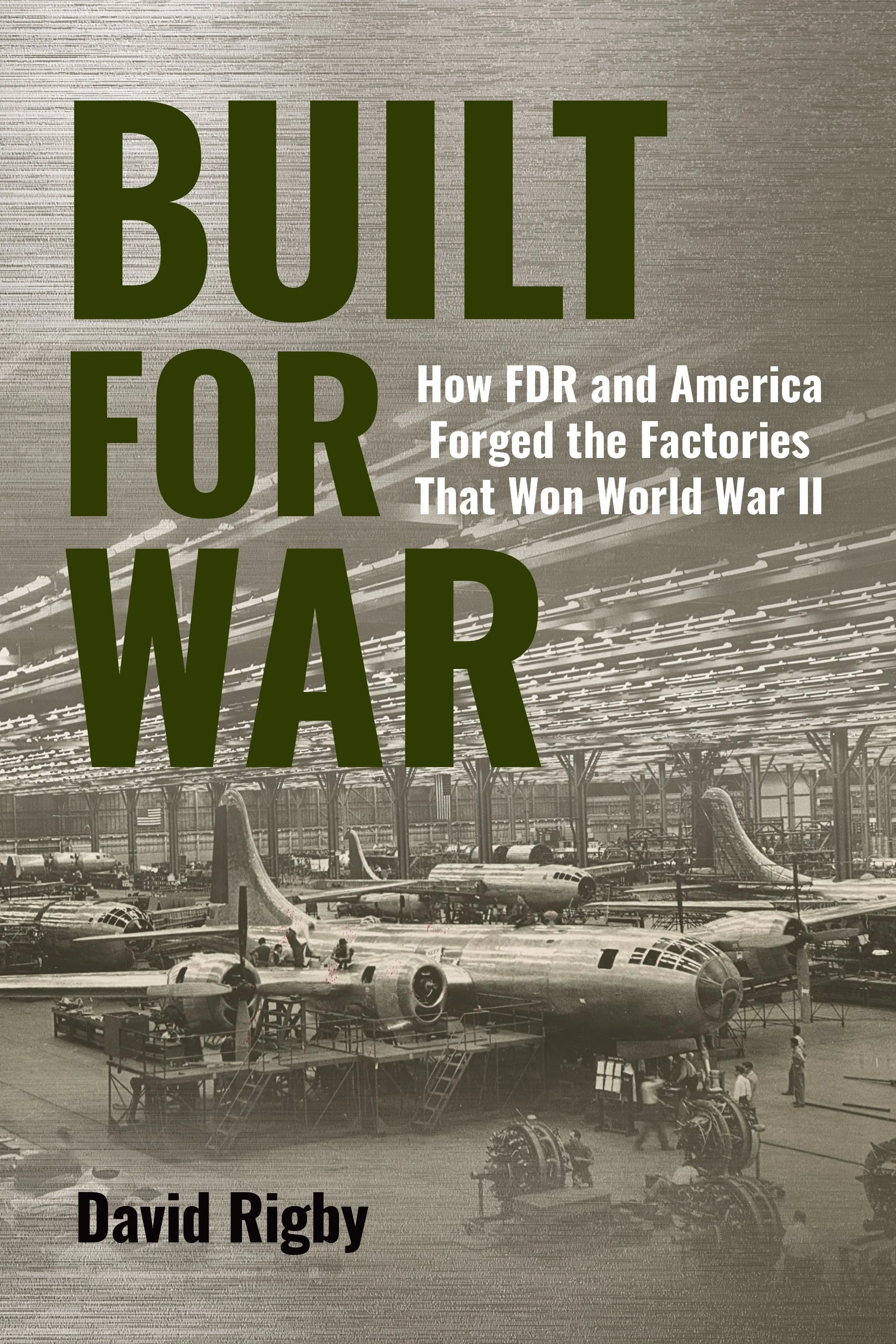 WWII War planes being manufactured in a large warehouse