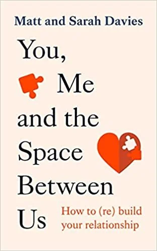 Book cover titled 'You, Me, and the Space Between Us' by Matt and Sarah Davies, featuring a red puzzle piece and a red heart with a puzzle piece cutout.