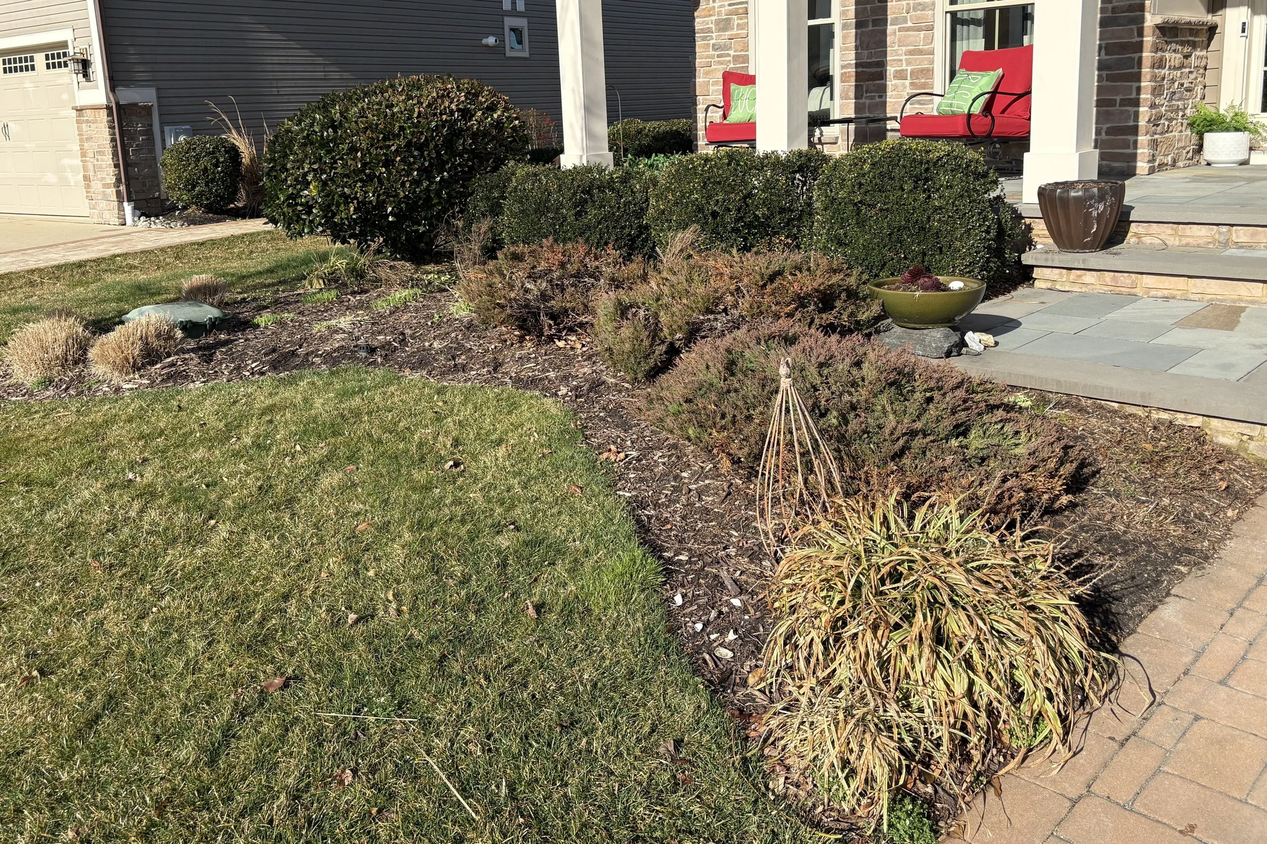Garden bed before edging and mulch installation in Frankford