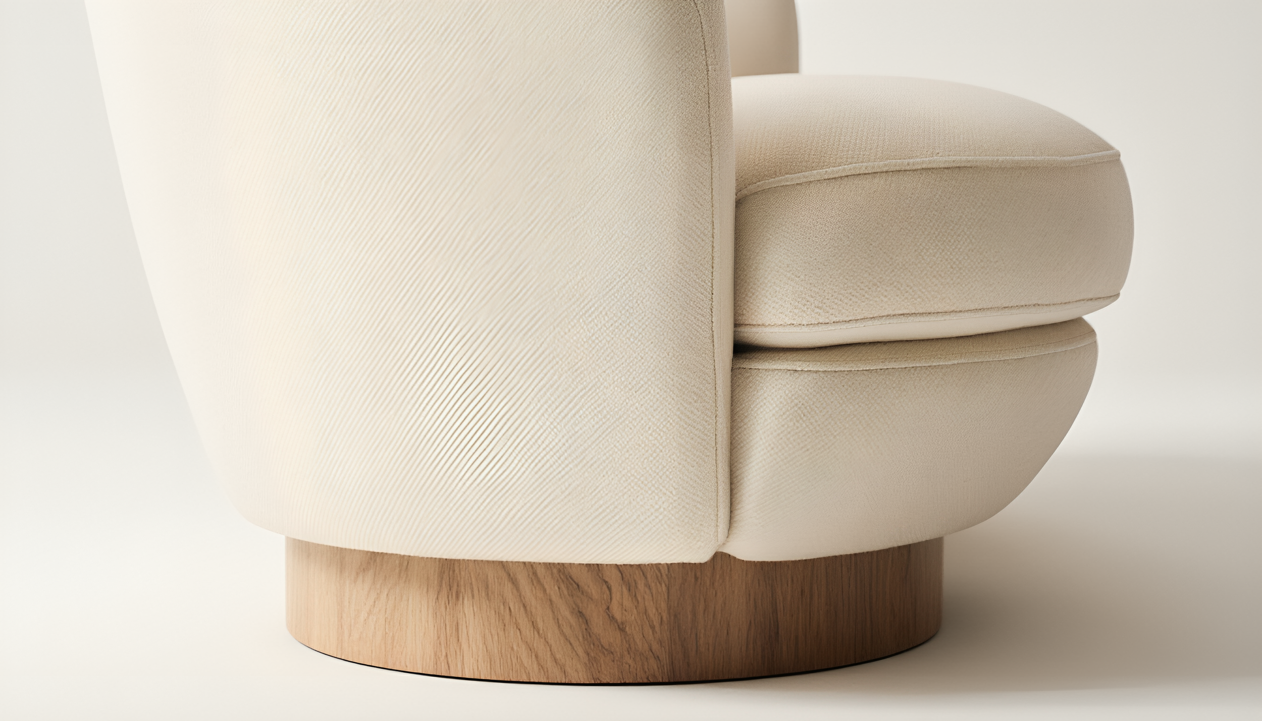 Close-up of a beige upholstered chair with a rounded wooden base.