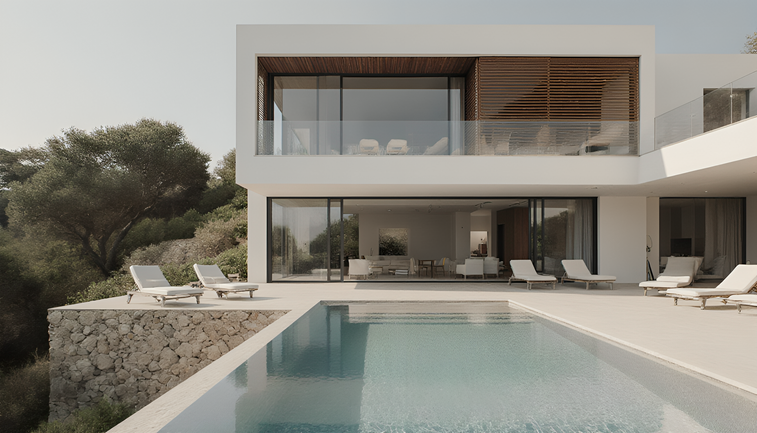Modern white house with large glass windows and a swimming pool in the foreground, surrounded by trees and outdoor lounge chairs.