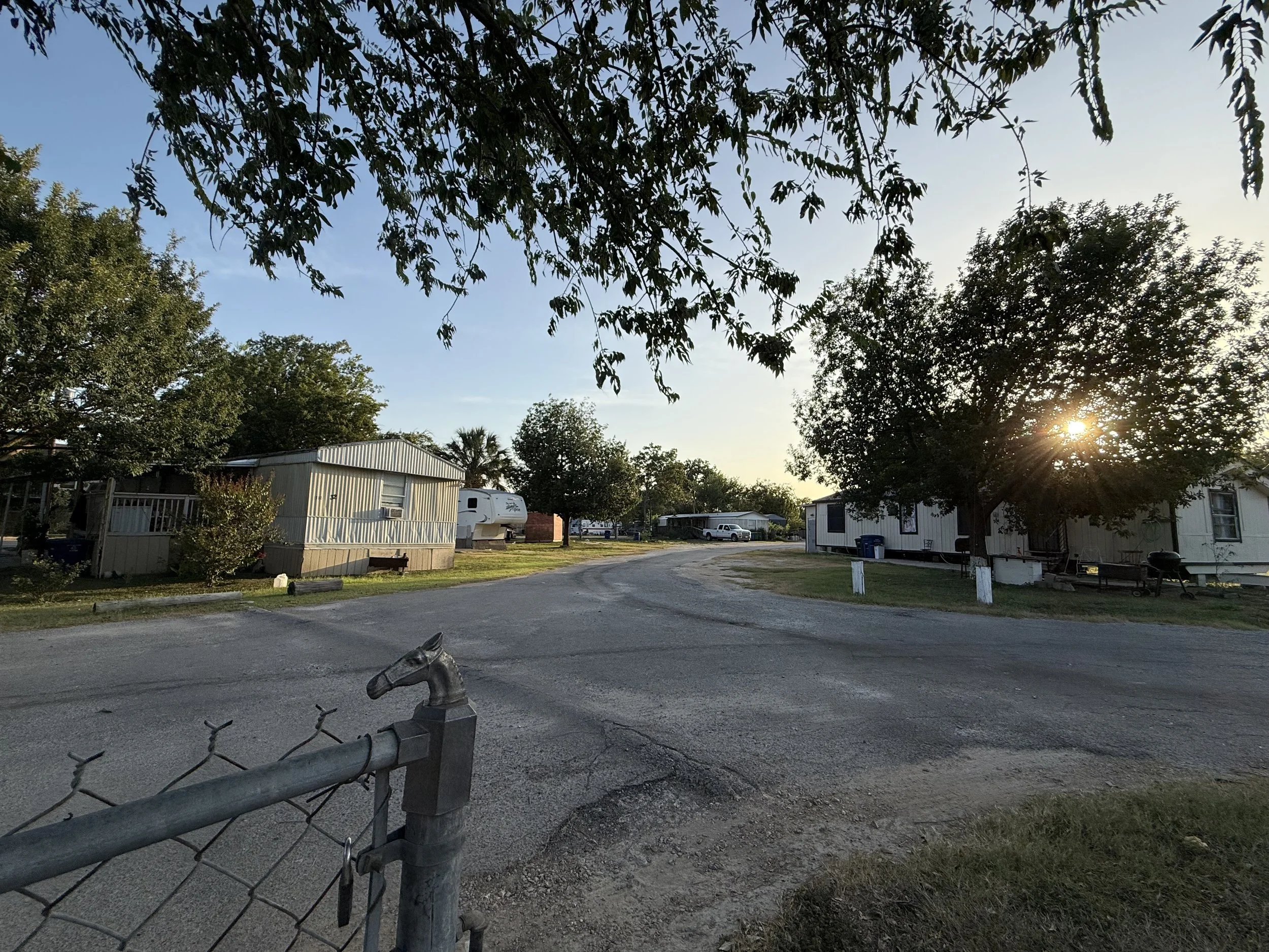 Entrance to Flores Crossing RV community in San Antonio at sunset