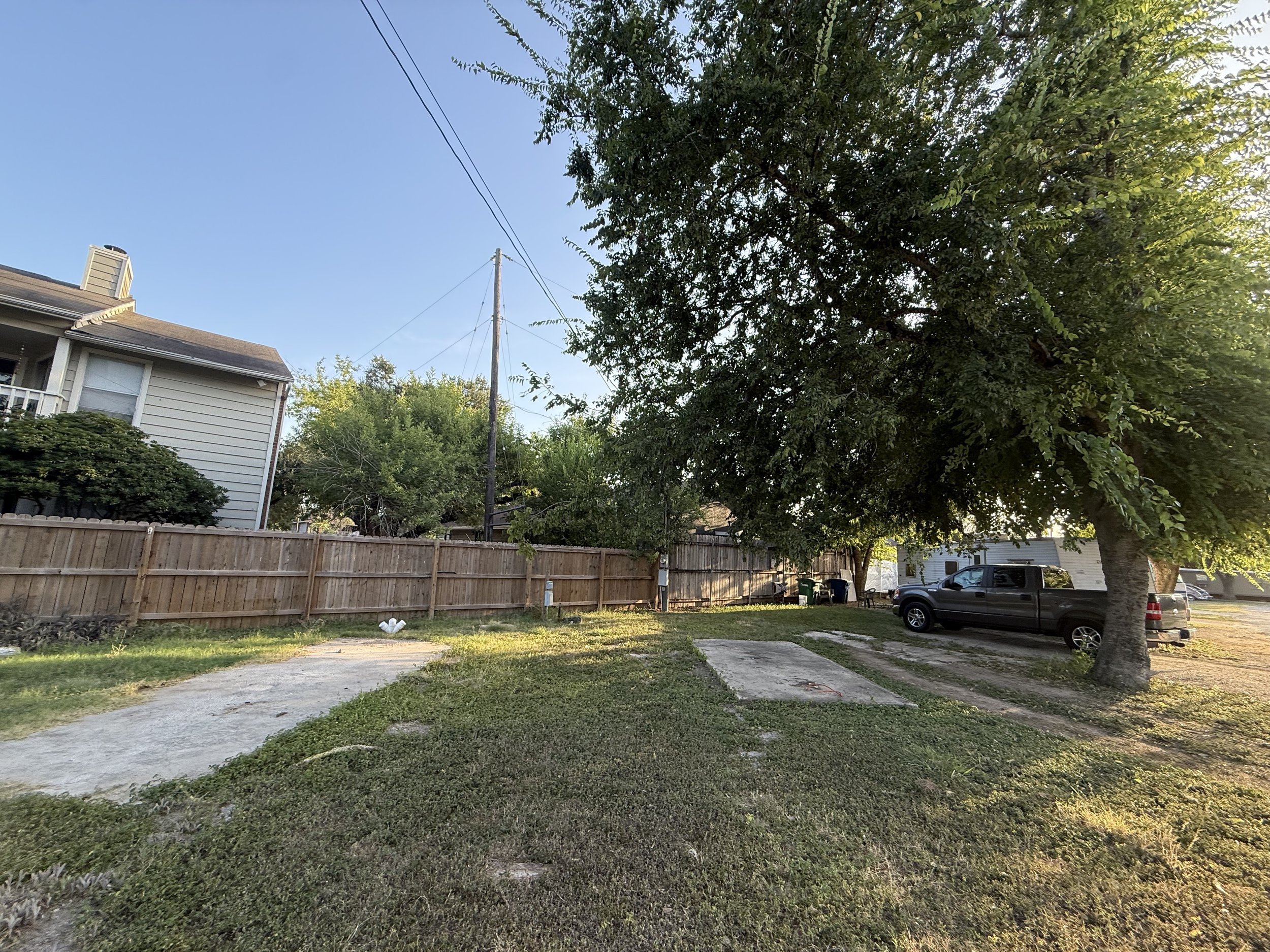 Available RV lots with concrete pads and shade trees at Flores Crossing in San Antonio