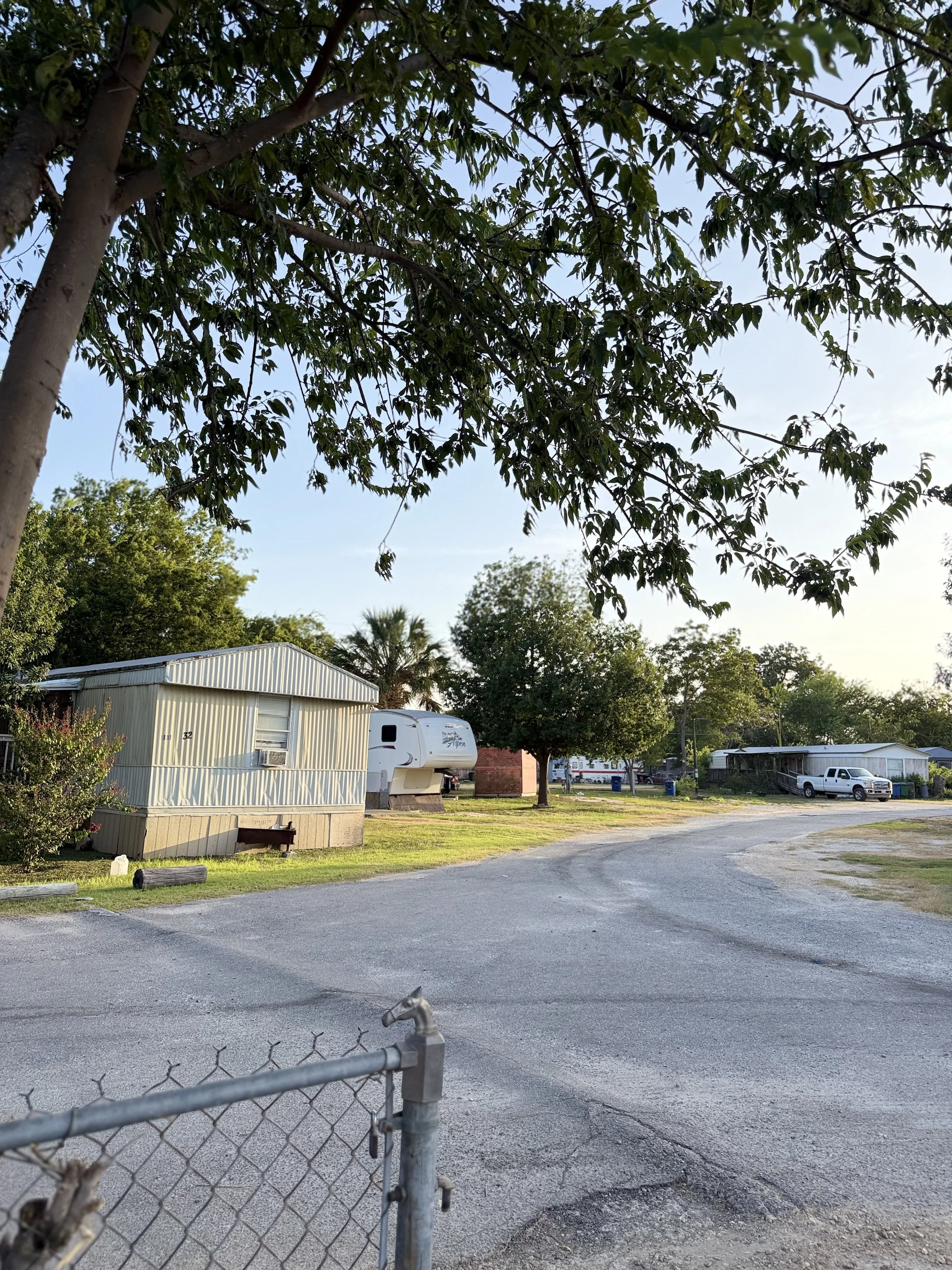 Interior roadway through Flores Crossing long-term RV community in San Antonio