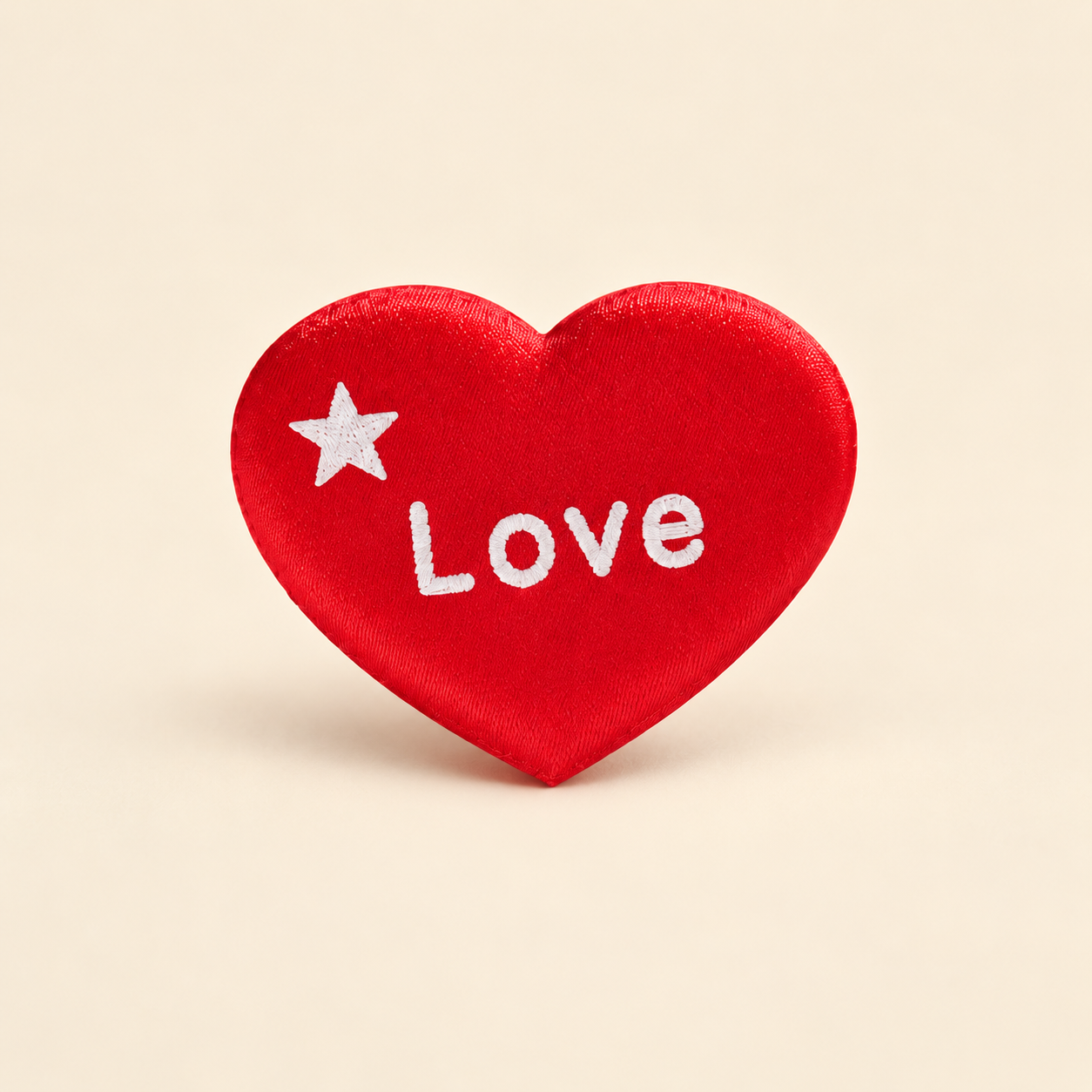 Red satin wish heart with a white star and the word Love