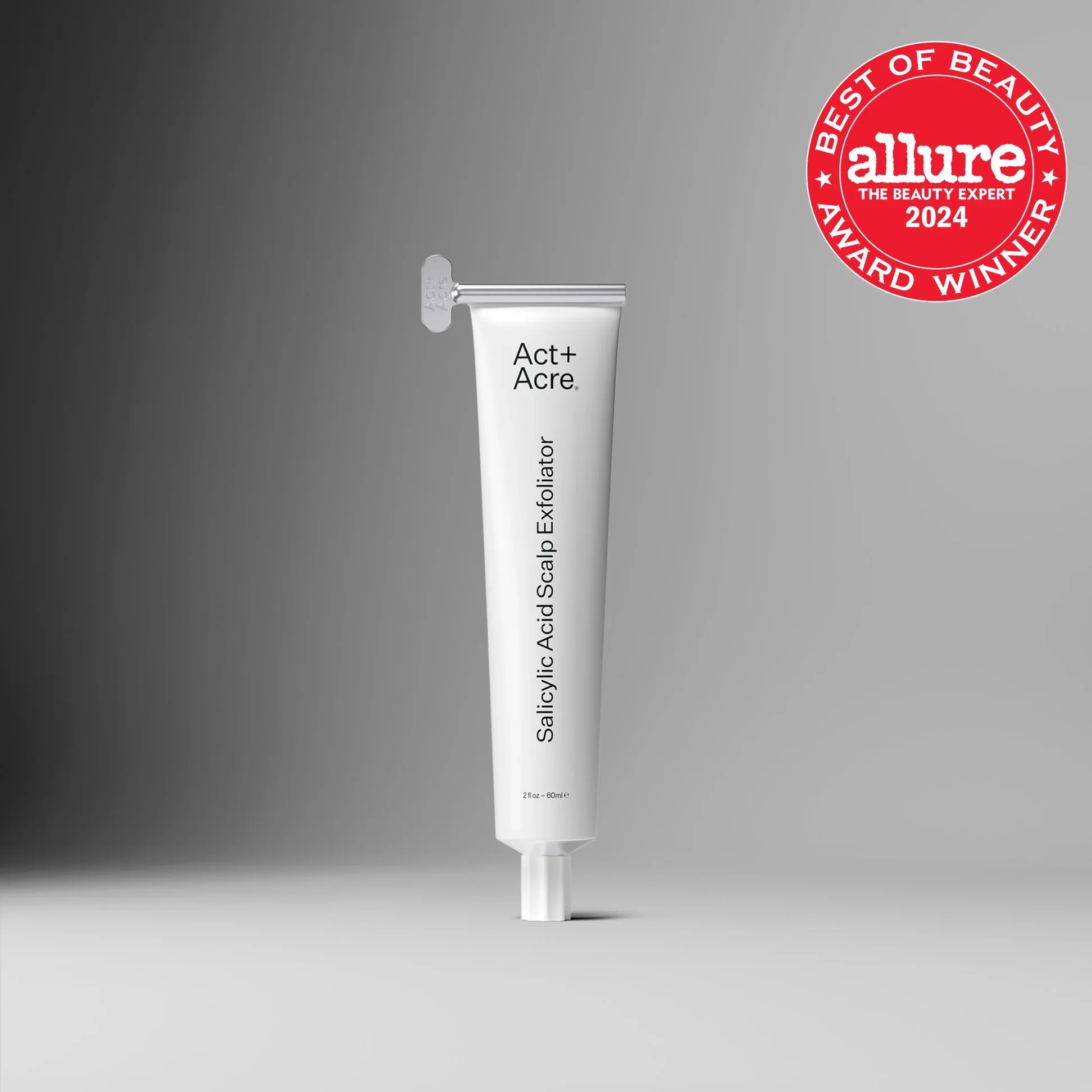 A white tube of Sally Hansen Acid (plus) Scalp Exfoliant with a silver applicator tip is displayed against a grey background. A red circular badge on the upper right reads 'Allure Best of Beauty Award Winner 2024.'