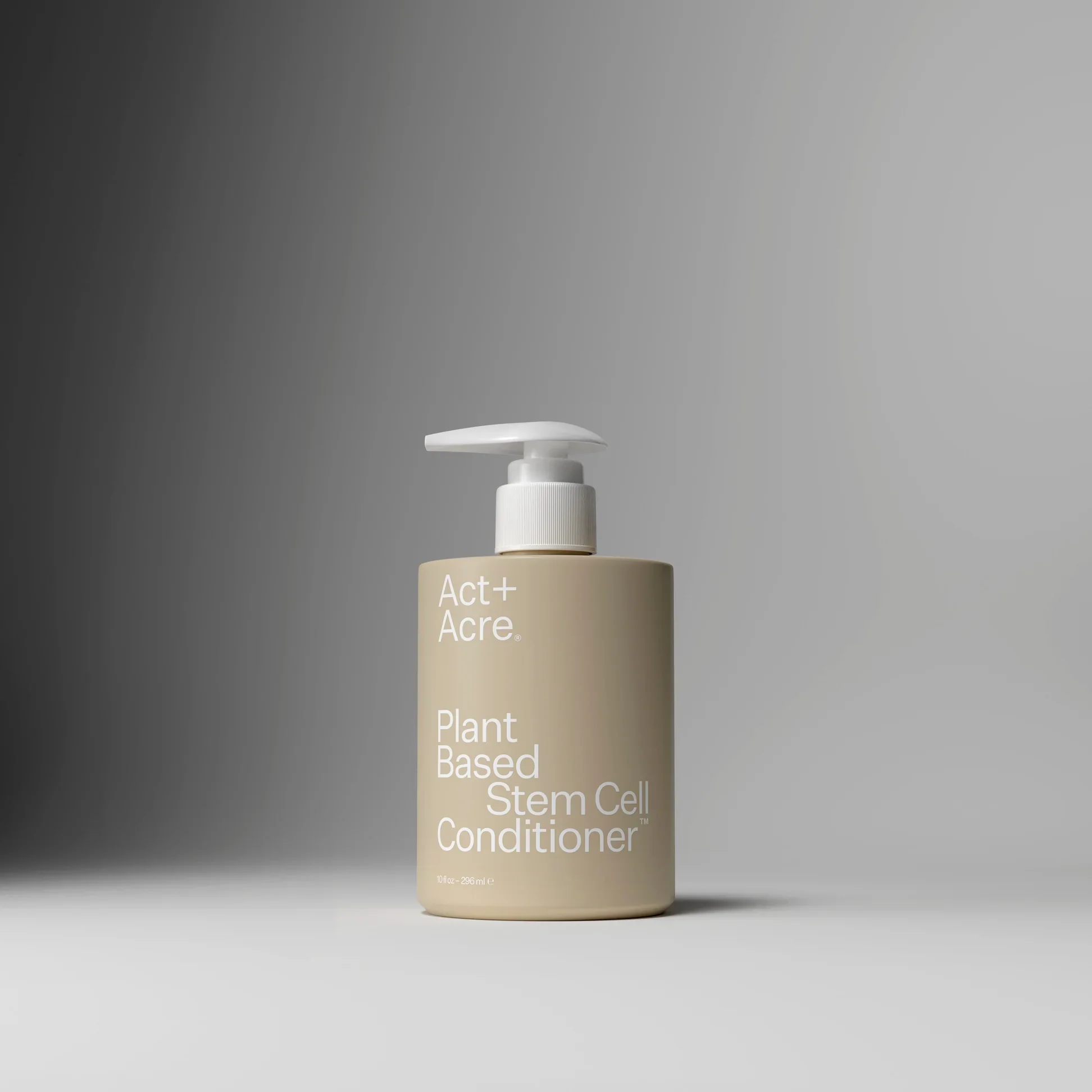 Bottle labeled 'Act Plus Acre Plant Based Stem Cell Conditioner' with a pump dispenser, set against a gray background.