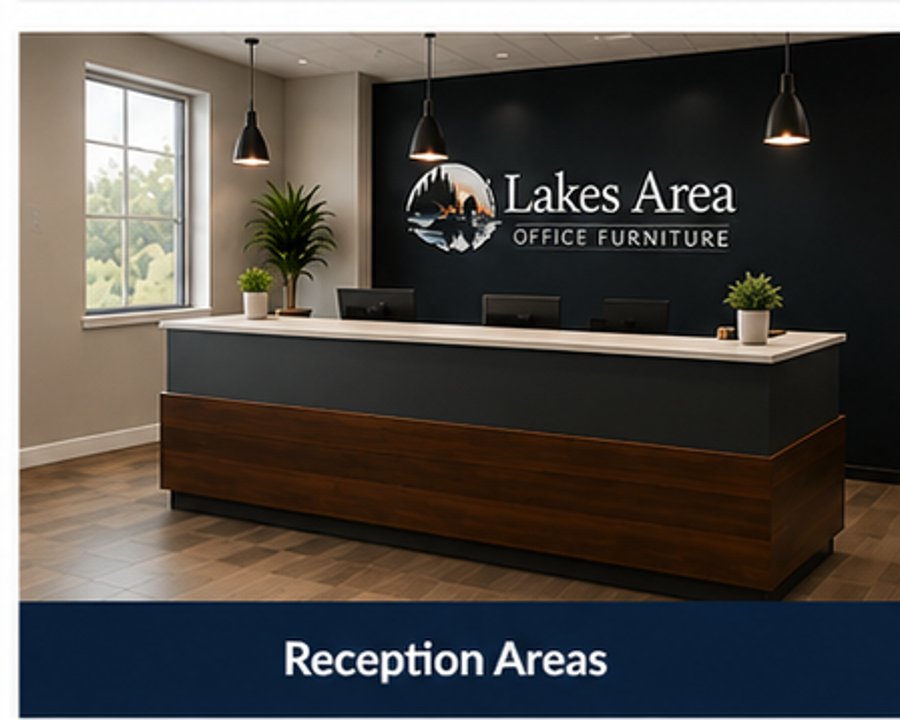 Reception desk at Lakes Area Office Furniture with a dark accent wall, logo, and potted plants.