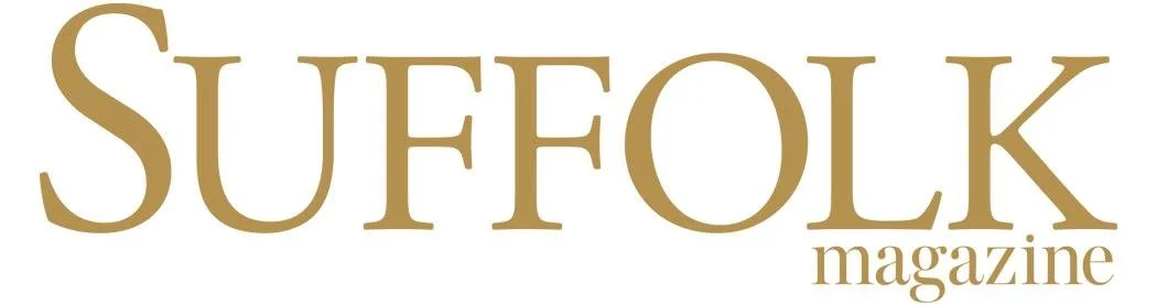 Suffolk Magazine logo in gold text on white background.