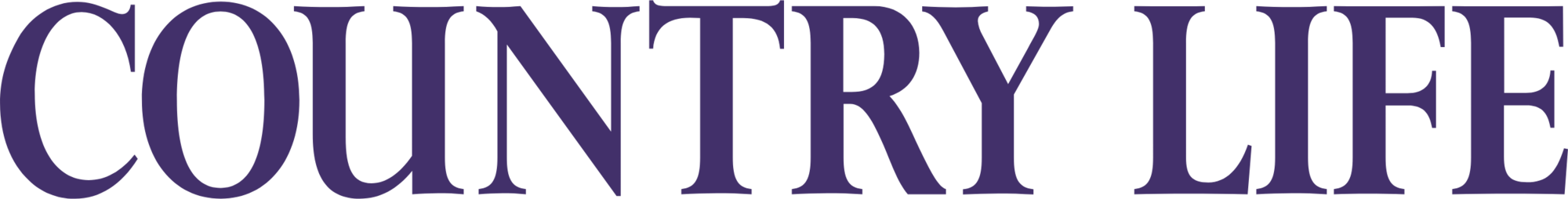 Close-up of a large sign with the text 'COUNTRY LIFE' in purple capital letters on a black background.