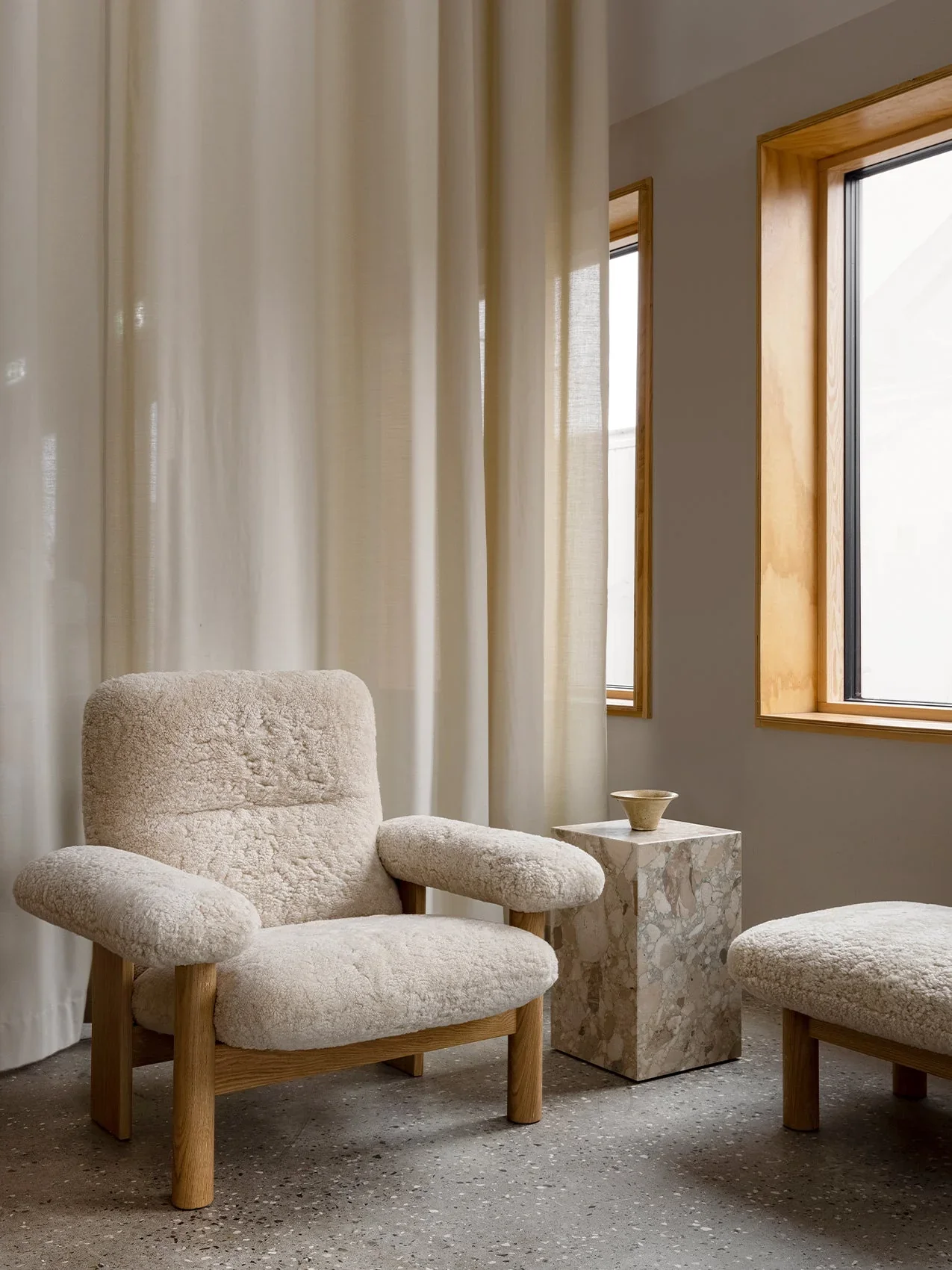 MENU_Brasilia_Lounge_Chair_Sheepskin_Brasilia_Ottoman_Plint_Cubic_383eab06-7c8d-4850-a2af-94a49ac81e42.webp
