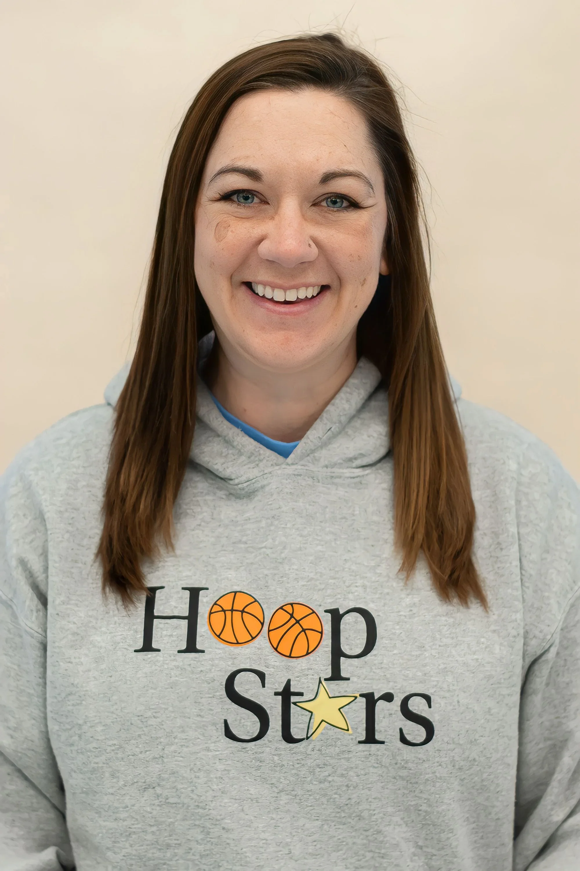 Headshot of smiling Coach Jess