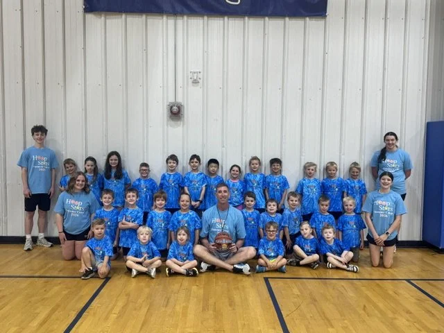 An image of elementary aged students playing in Hoop Stars Summer Basketball Camp in Centre County, PA