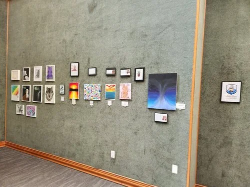 Student artwork displayed across a gallery wall during the 2026 exhibition