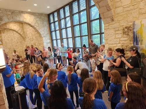 Students and families viewing artwork during the 2026 exhibition