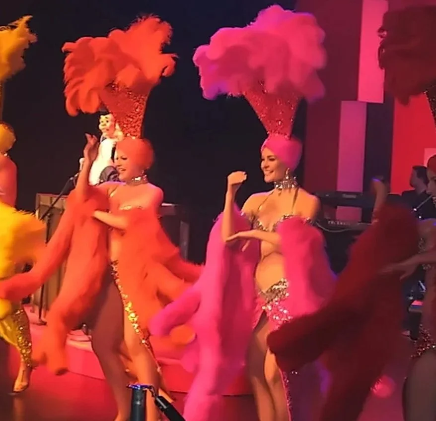 Tara Noseck performing as a showgirl on a Las Vegas stage