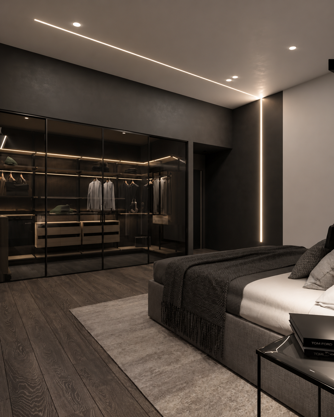 Luxury bedroom with dark wood flooring, a gray bed with black and gray pillows, a bedside table, and a walk-in closet with glass doors, black frames, and hanging clothes illuminated by sleek LED lighting.