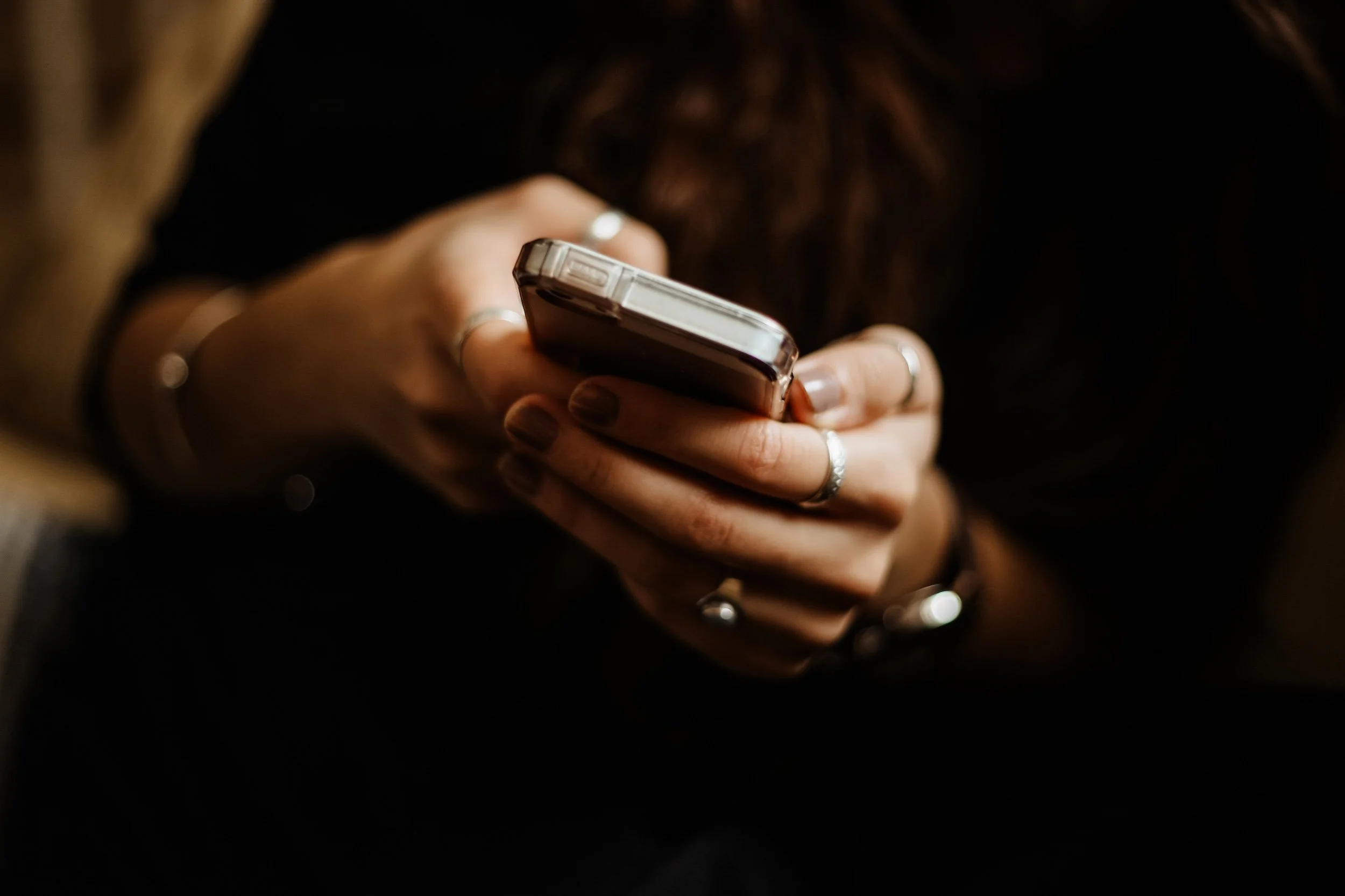 Photo of Hands Dialing a Phone
