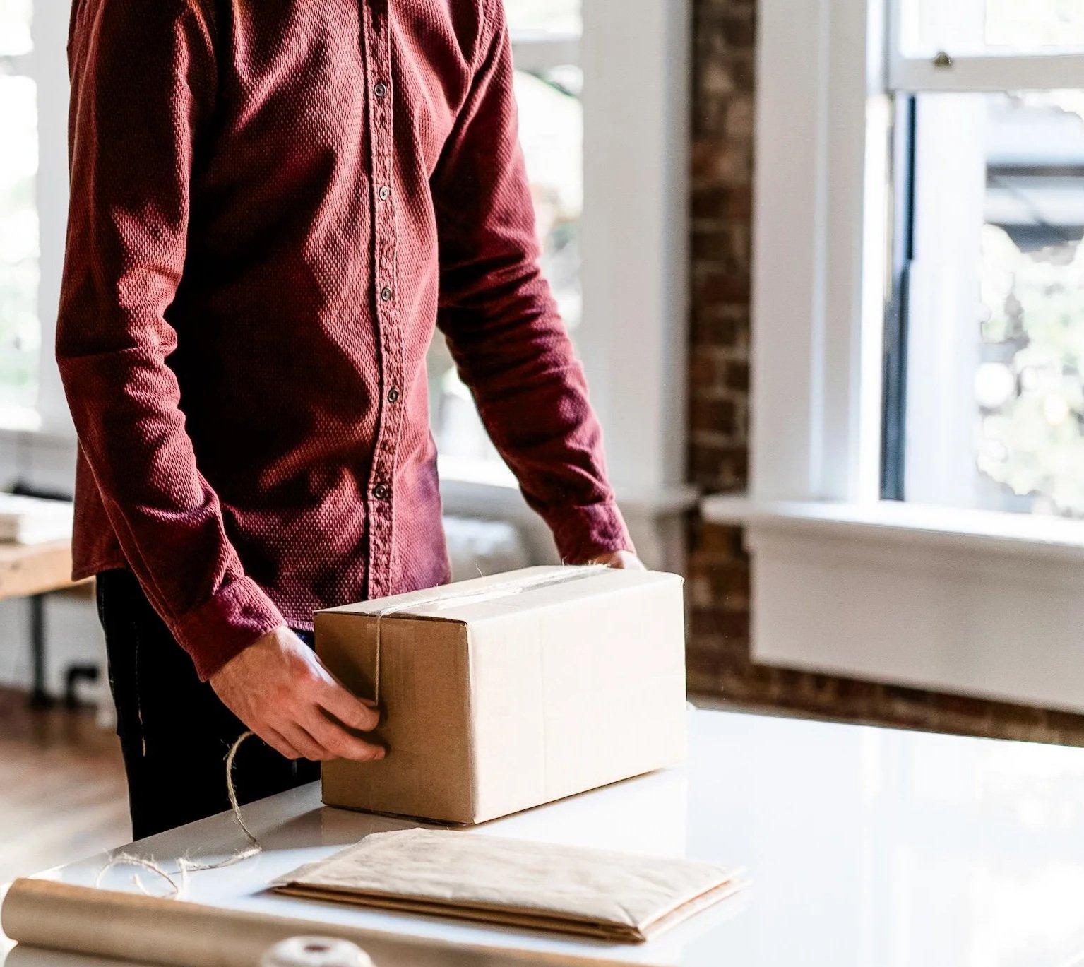 Photo of a Happy Customer Opening Their Package