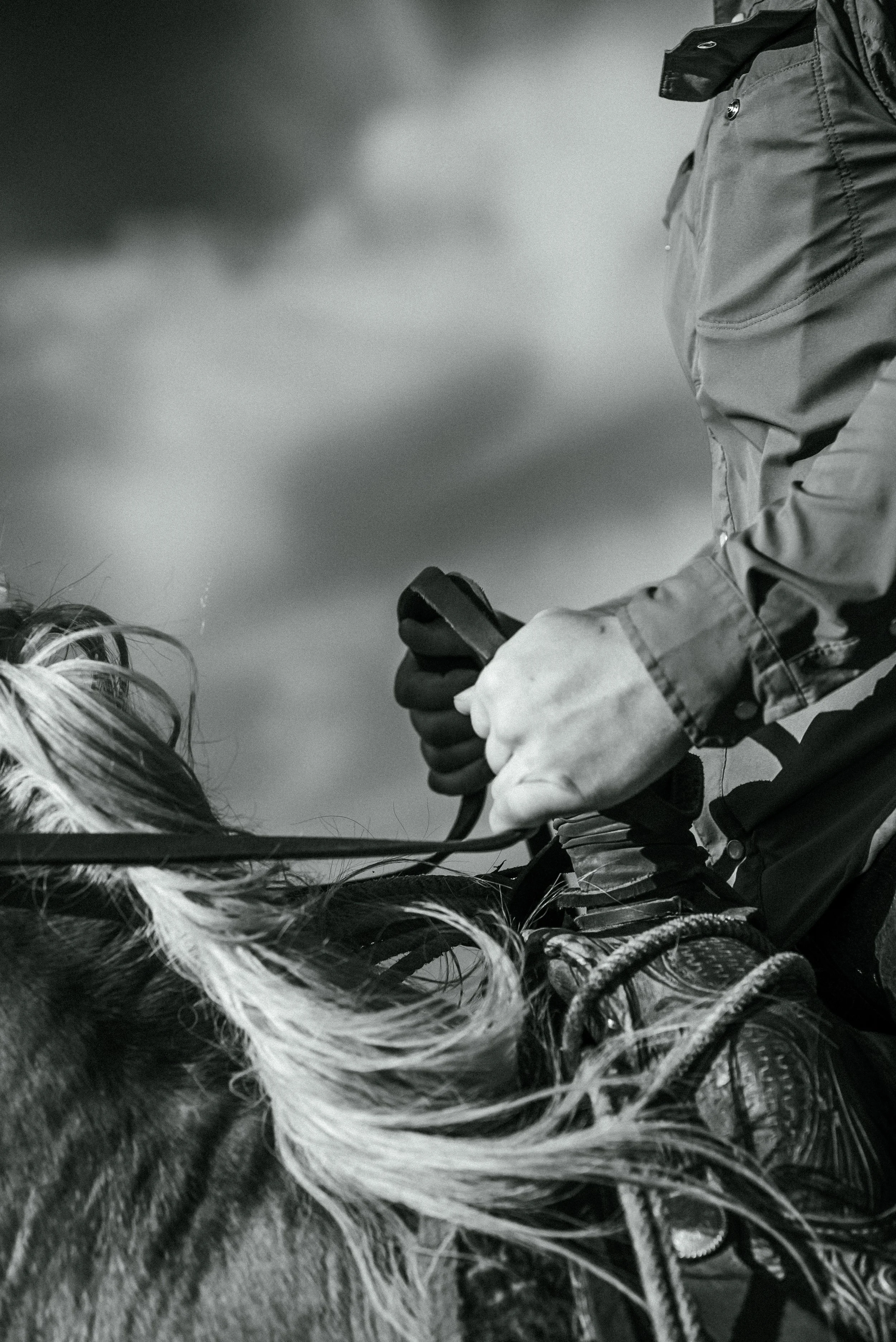 Cinematic portrait of a cowboy holding the reins of a palomino horse in a western setting