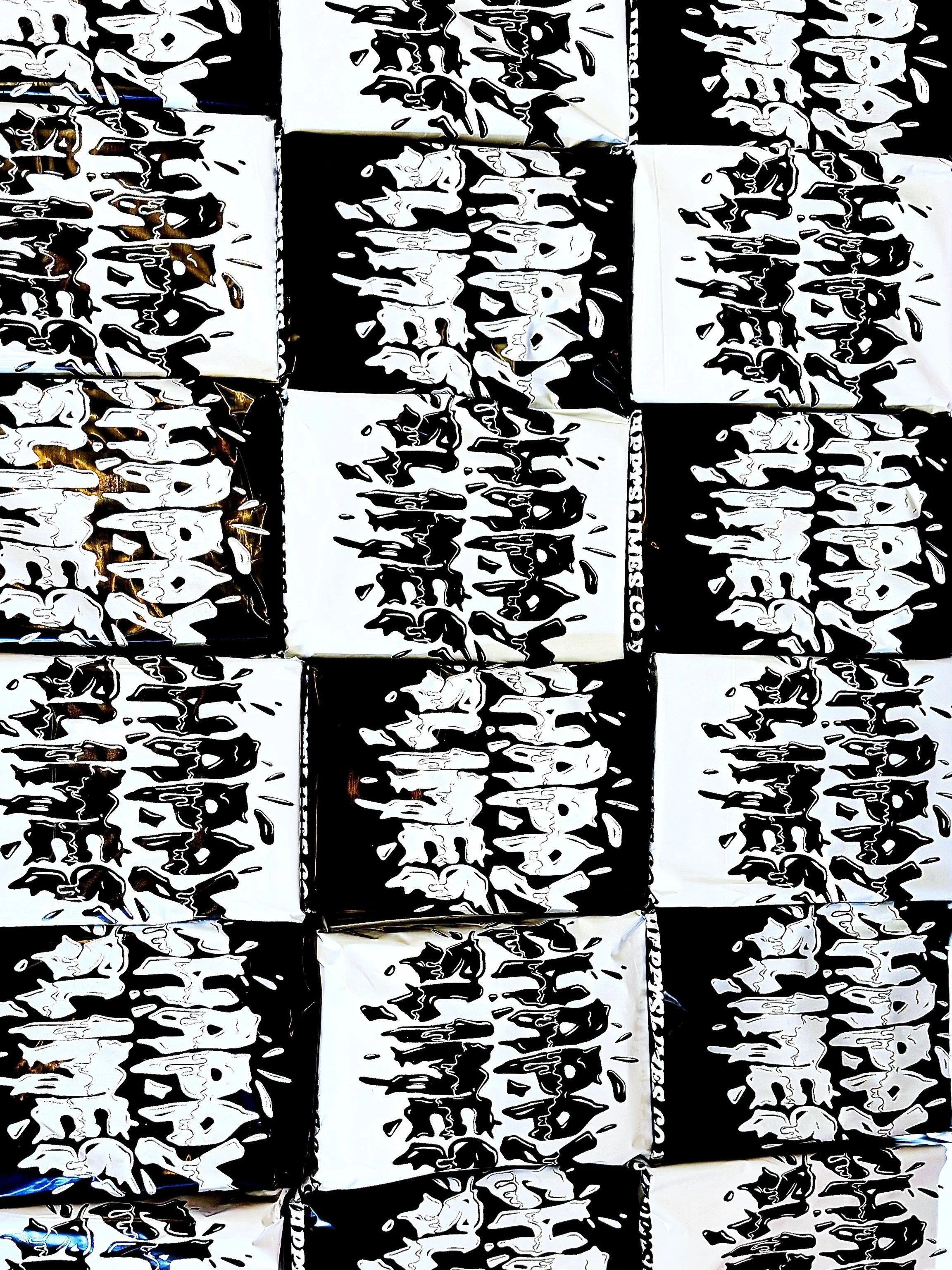 Multiple black and white boxes with abstract patterned designs.