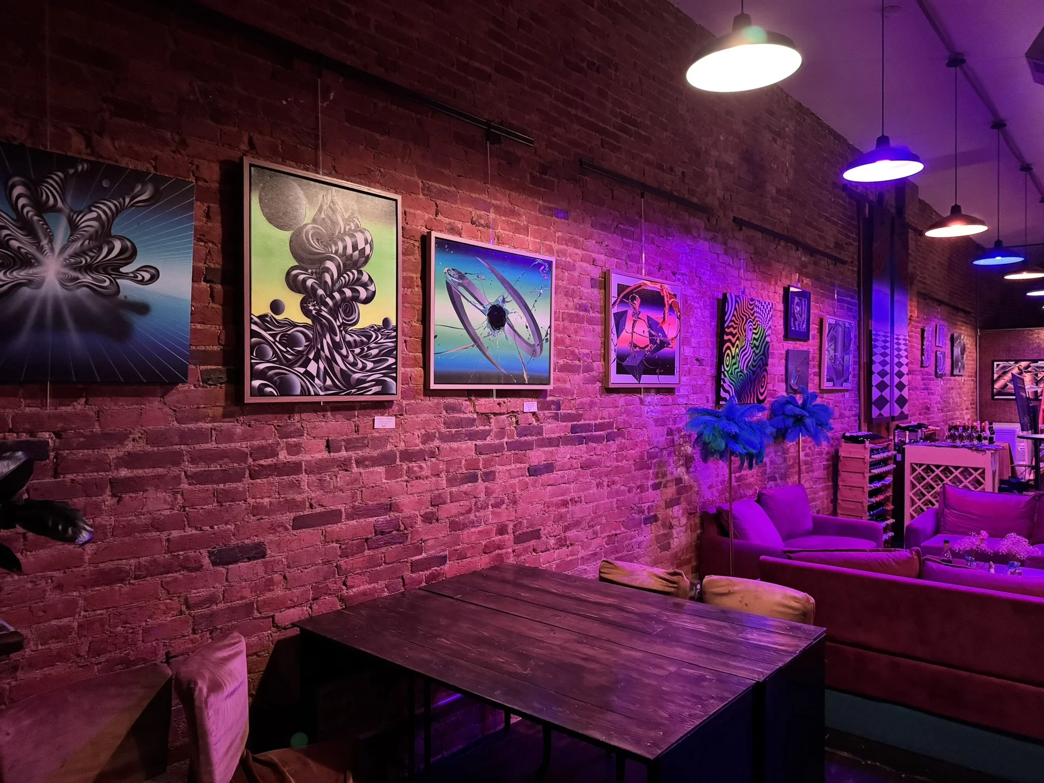 view of the gallery in the evening with blacklights on