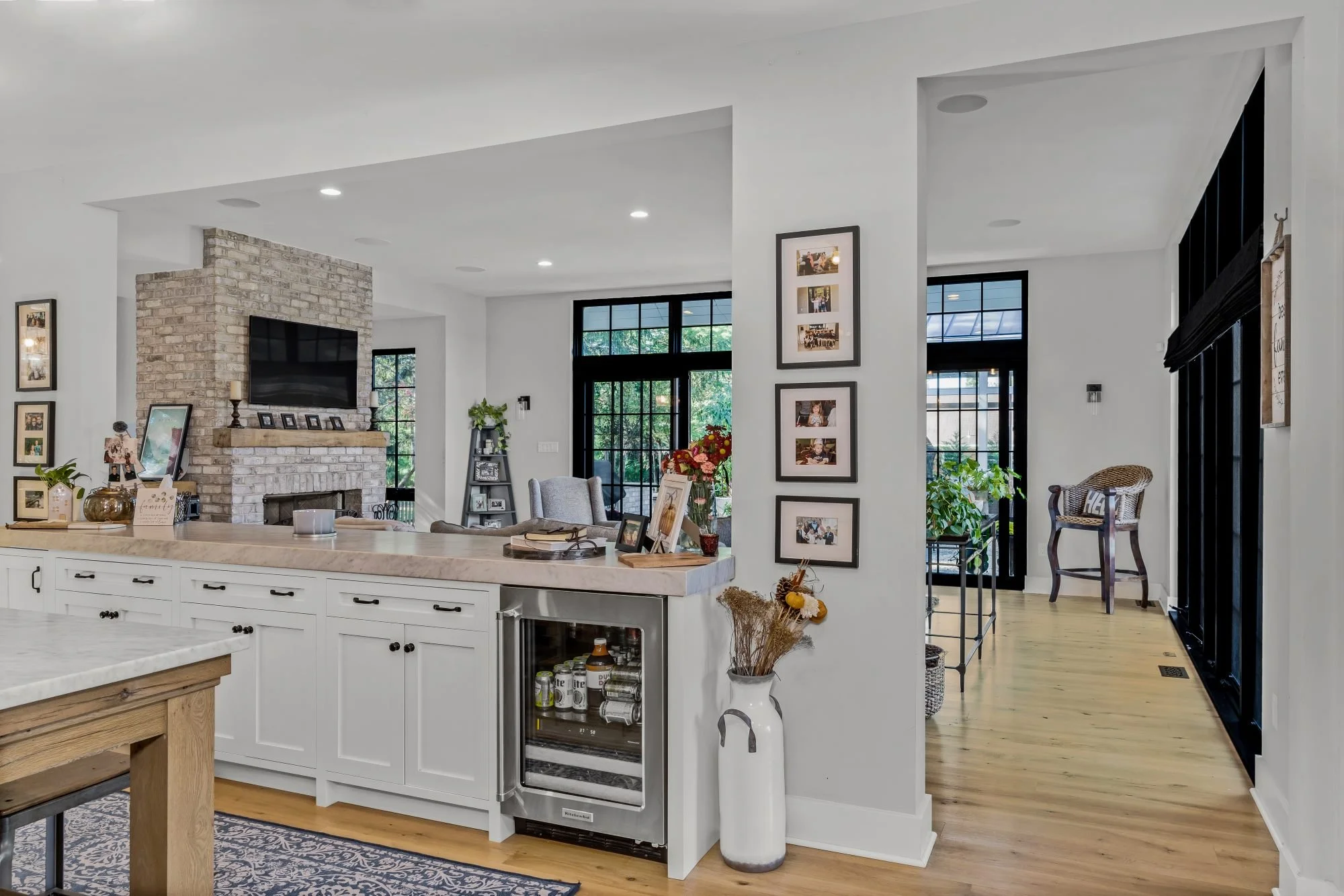 indoor-outdoor-living-kitchen-family-room-floor-to-ceiling-windows-glass-doors.jpg