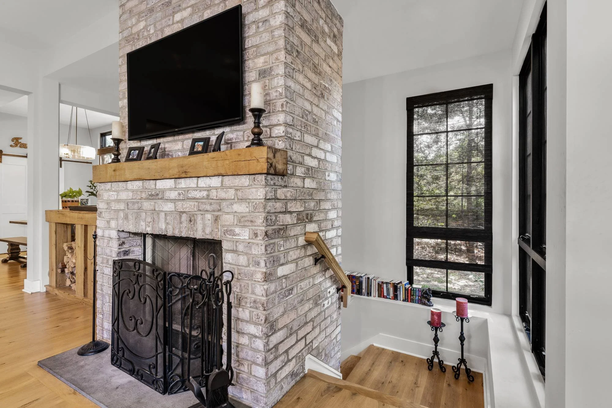 sunlit-living-room-floating-fireplace-mass-with-wrapping-stair-haddonfield-nj.jpg