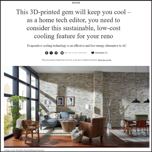 Living room with exposed brick wall and large windows featured in article on sustainable cooling technology, with insights from architect Jay Reinert of J Reinert Architecture.