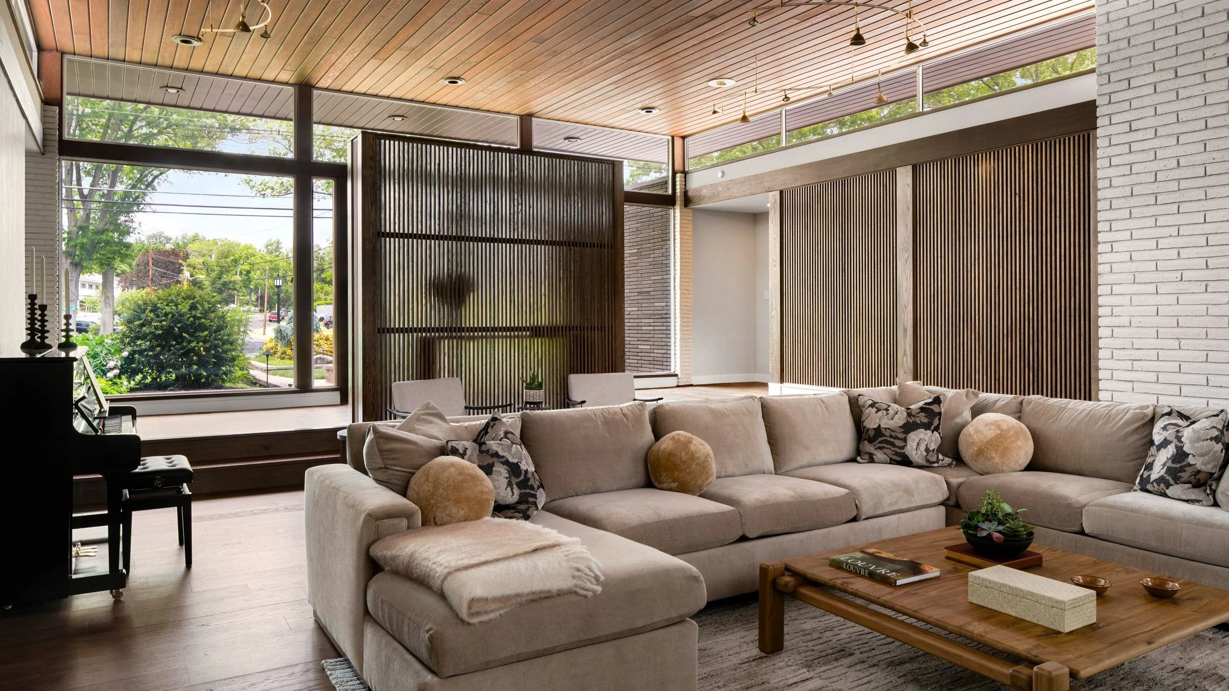 Mid-Century Modern Revisited in Cherry Hill, NJ, with restored wood ceilings, slatted interior screens, expansive glass, and layered living space.