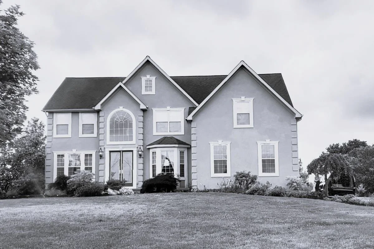 Before photo of a 1990s developer home in Mullica Hill, New Jersey, prior to a custom residential renovation by J Reinert Architecture.
