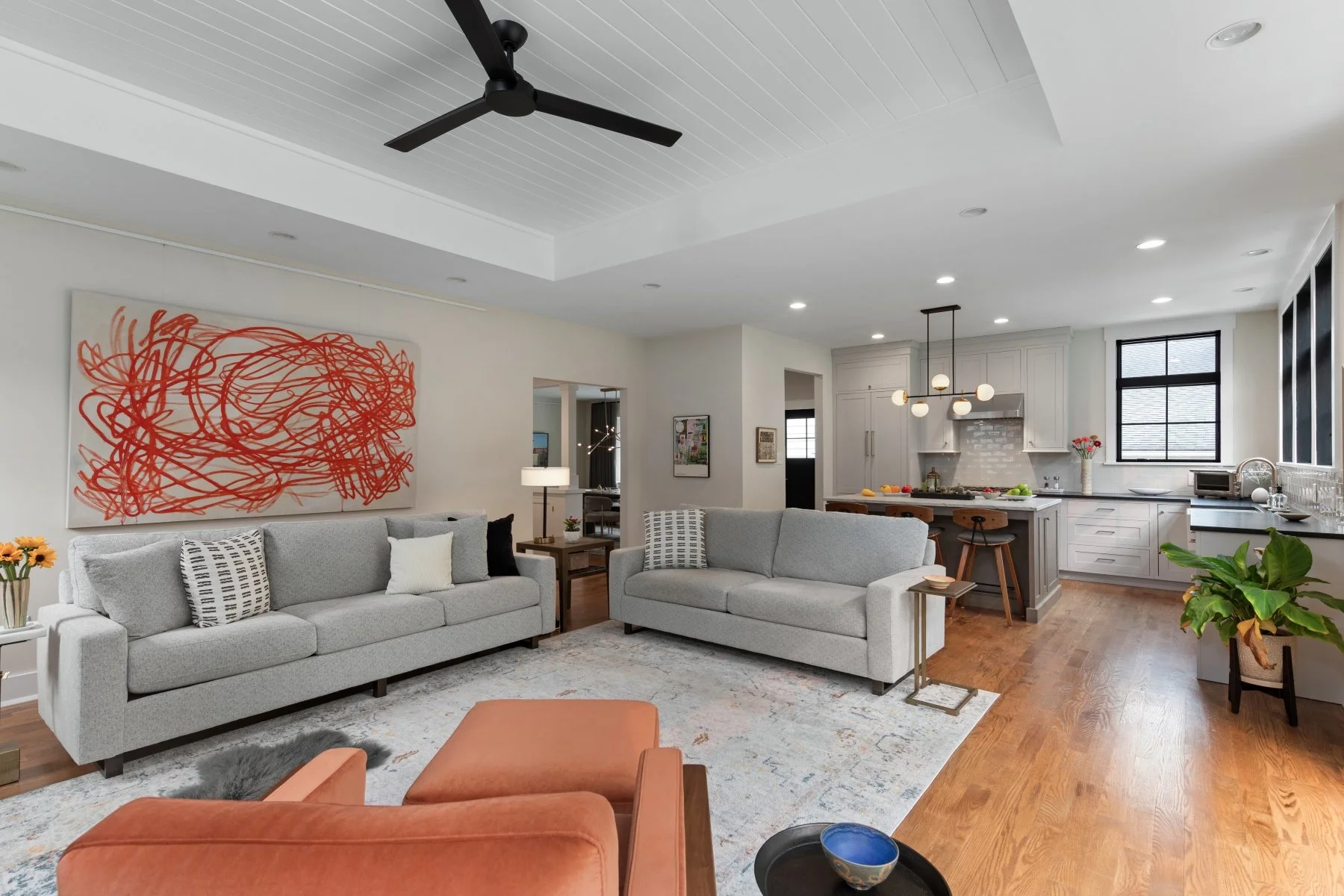 Family room and kitchen connection in Artfully Done contemporary Craftsman renovation in Haddon Heights, NJ, designed for art, gathering, cooking, and aging in place.