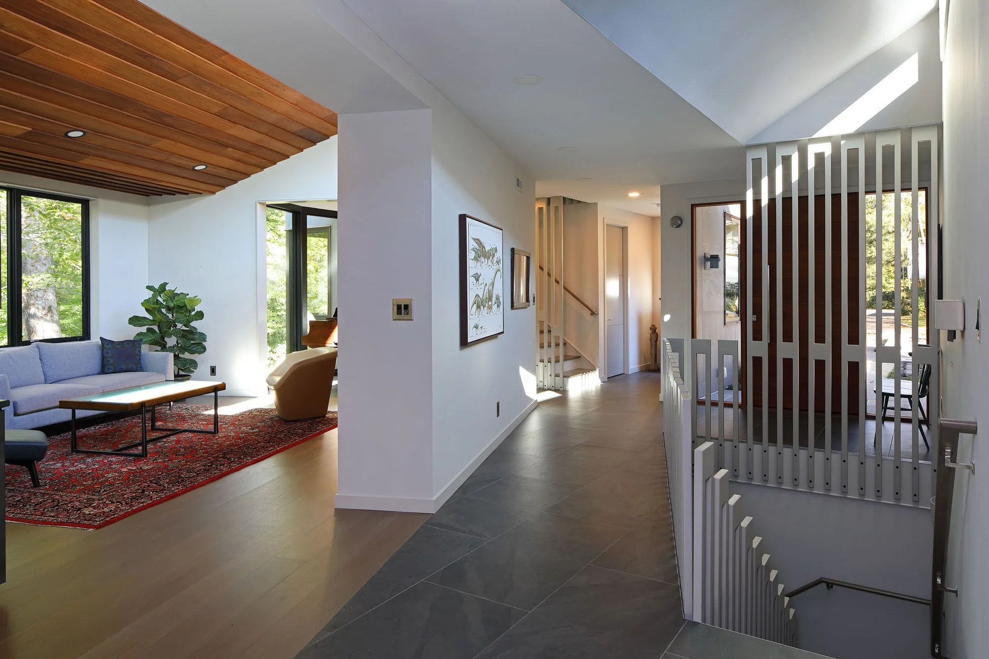 Sculptural CNC-fabricated stair railing at Hadro House in Haddonfield NJ, part of a Universal Design plan with level thresholds and single-floor essential living for aging in place