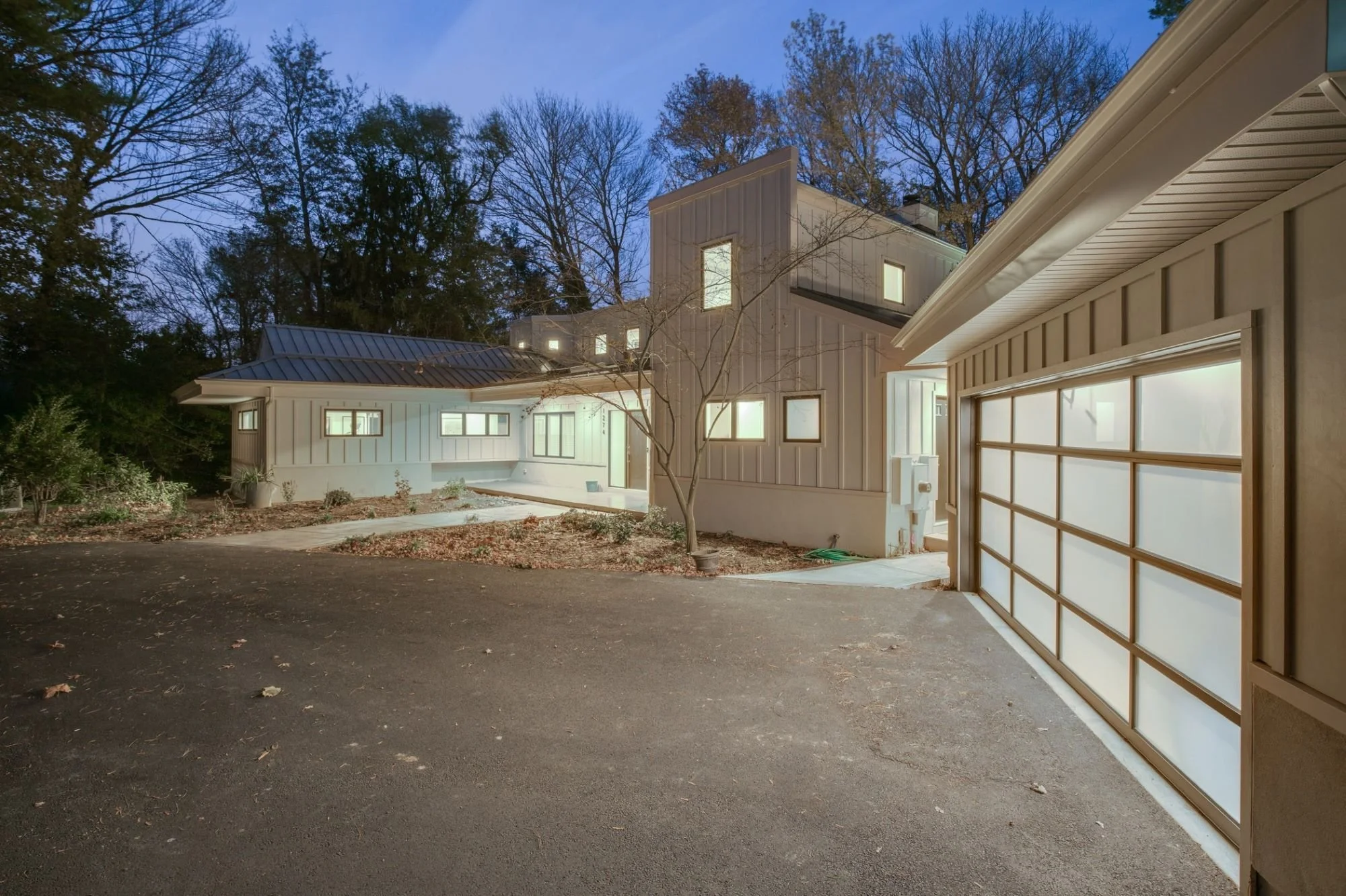 Twilight exterior of a renovated mid-century modern home in Cherry Hill, NJ, originally designed by architect Jack Williamson and renovated by architect Jim Hewitt.