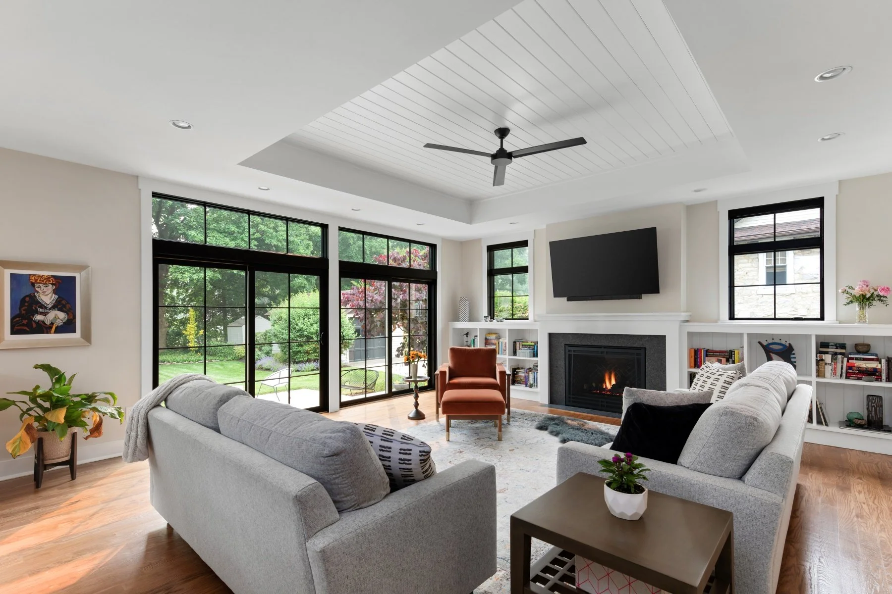 Family room with sliding glass doors to rear patio and garden in Artfully Done contemporary Craftsman renovation in Haddon Heights, NJ.