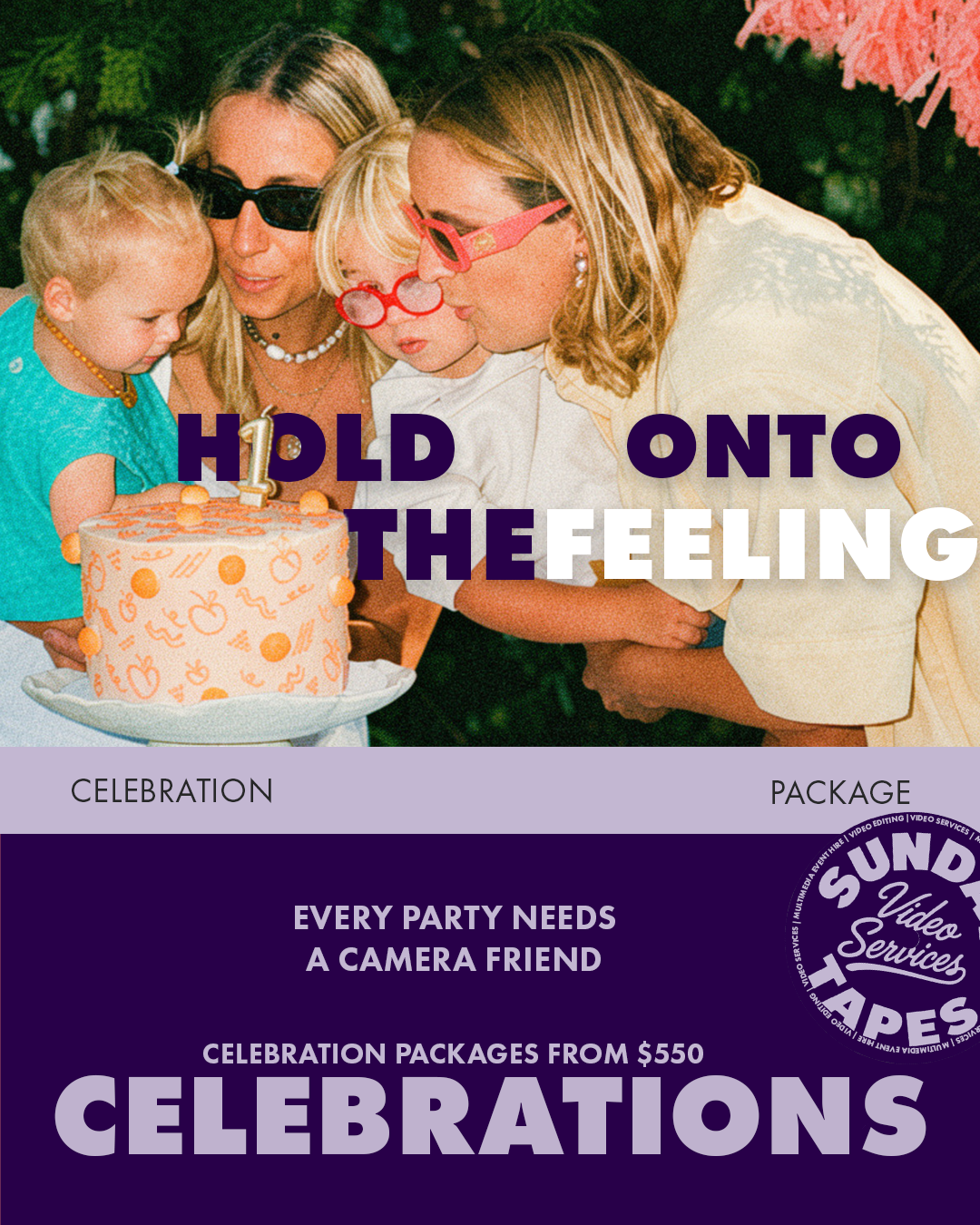 Four people, including two children and two adults, celebrating a birthday with a decorated cake, surrounded by greenery and pink flowers.
