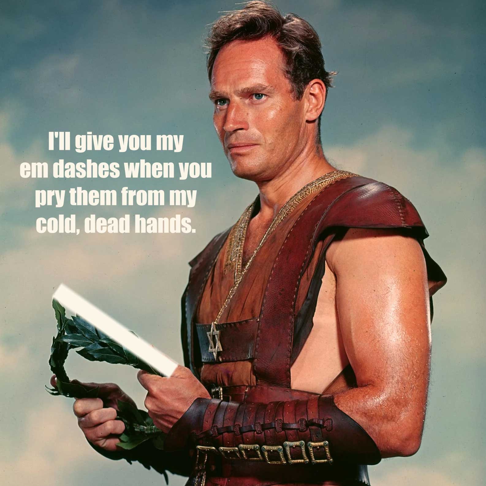 An image of Charlton Heston declaring that 'You can take my em dashes, when you pry them from my cold dead hands'.