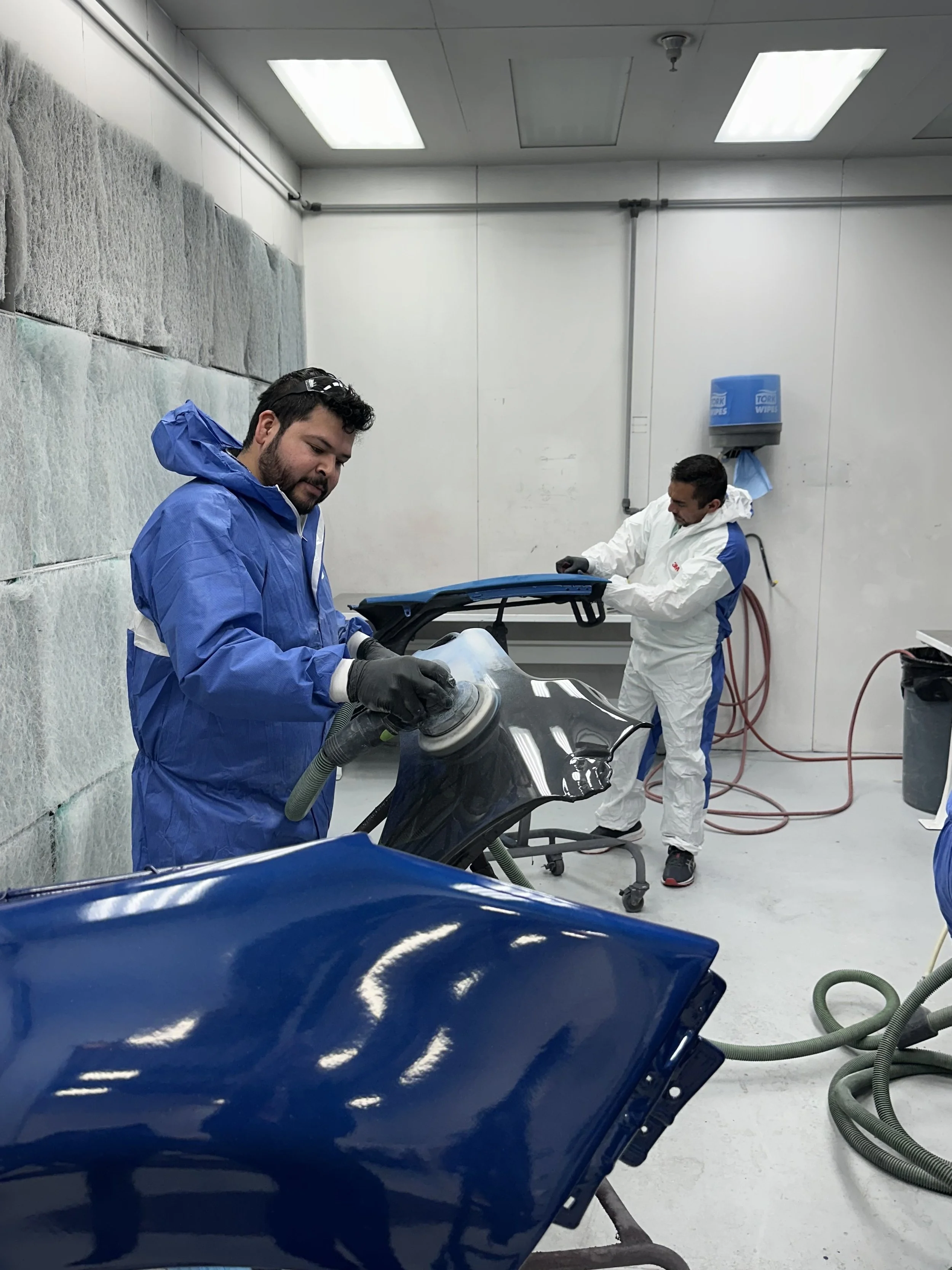 two professional auto body paint technicians