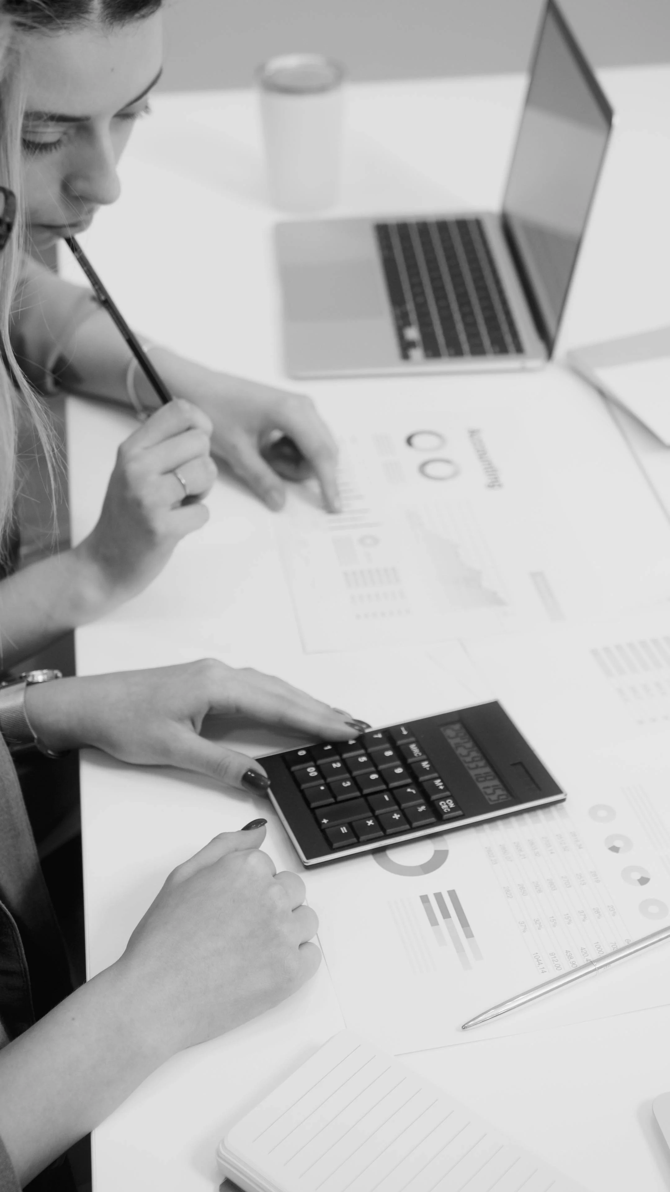ttorney reviewing financial statements and billing records at a desk, representing the revenue management challenges facing solo law firms.