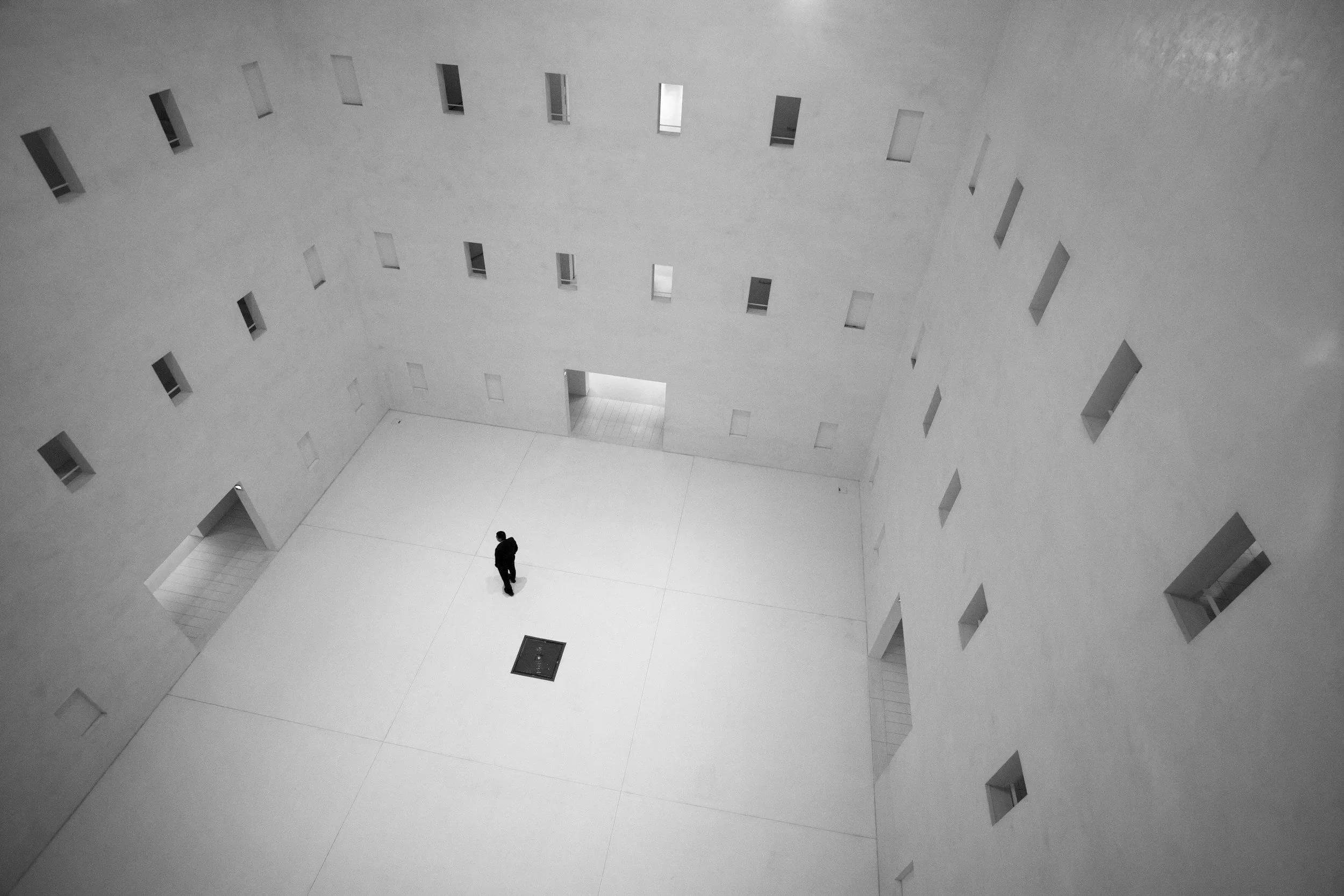 Person navigating a large abstract space, representing uncertainty about where to begin with law firm operations