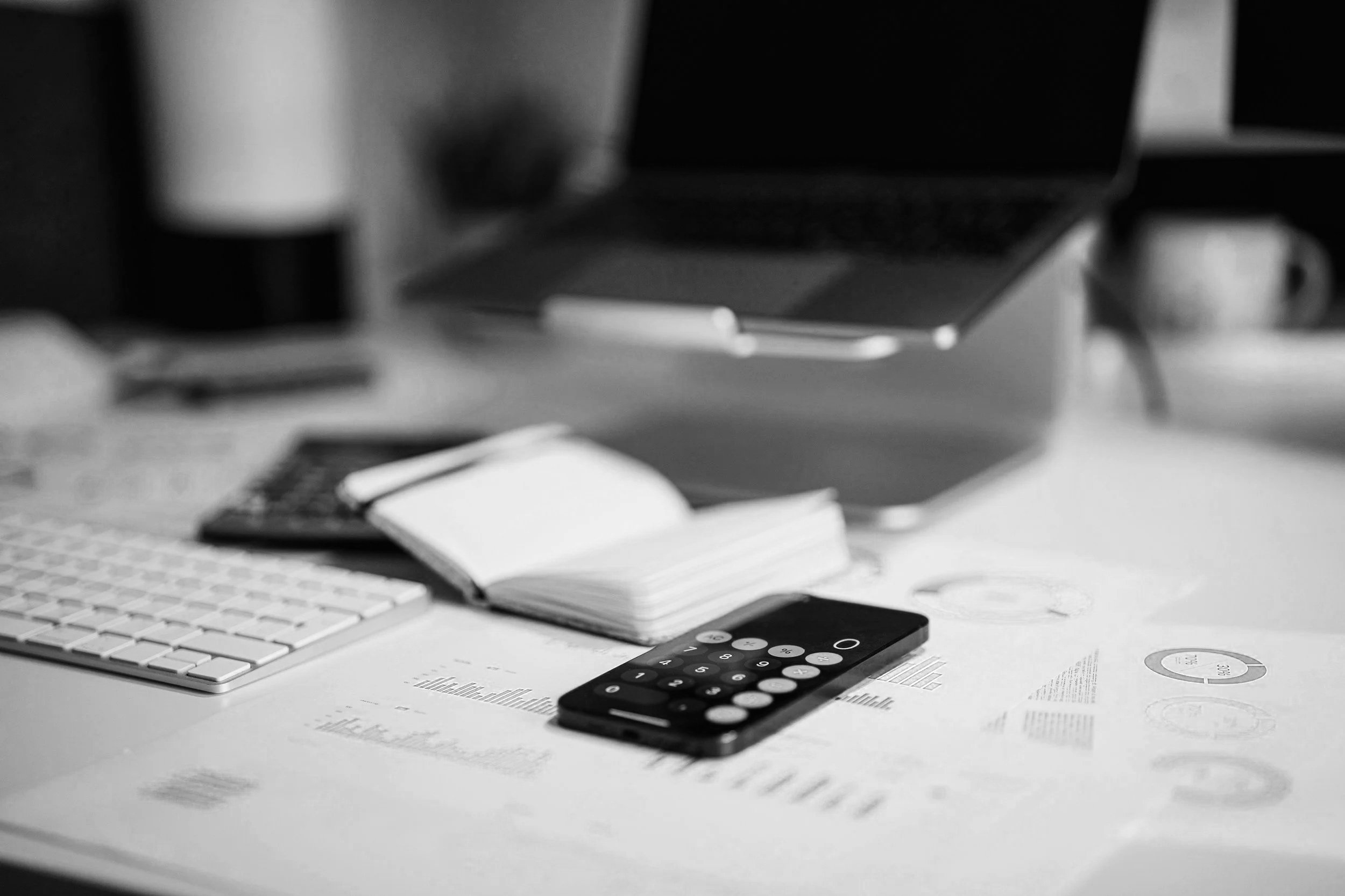 Calculator and financial documents representing law firm billing and accounts receivable management