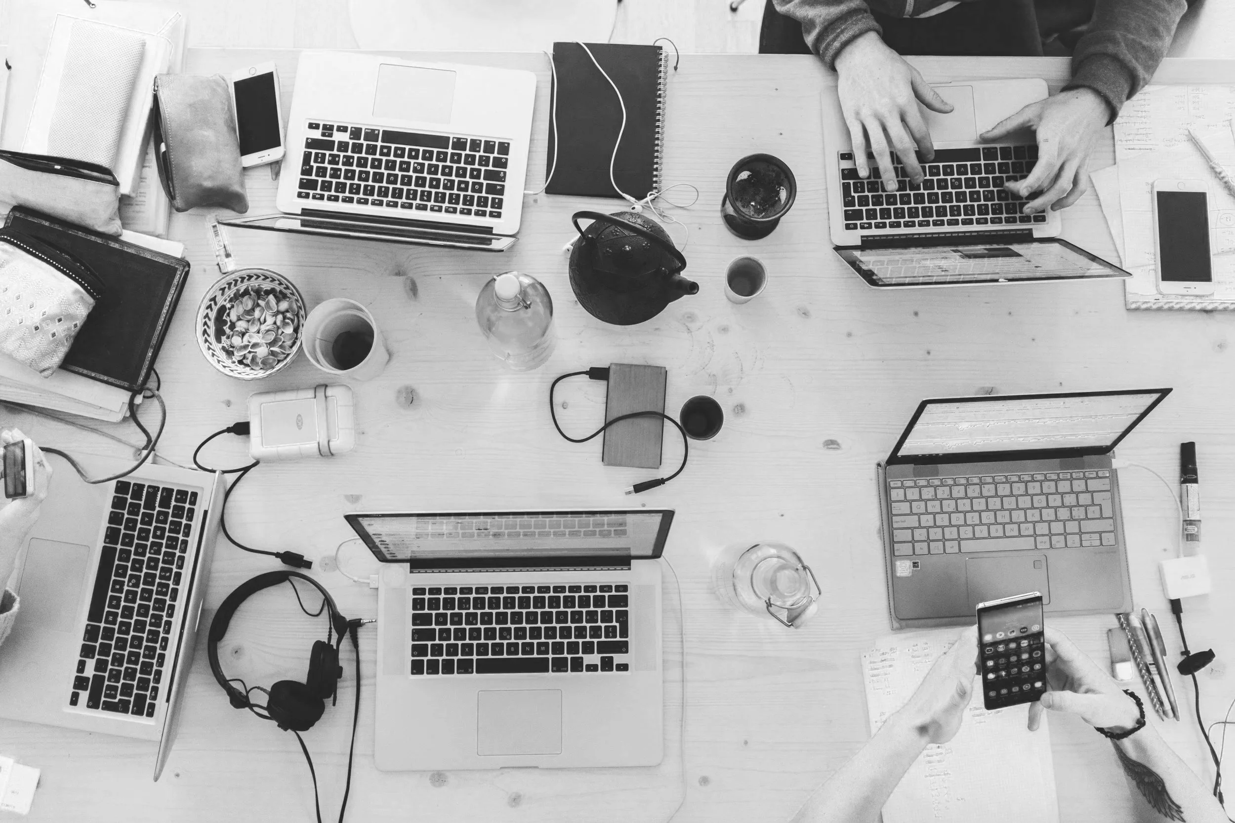 Law firm team using multiple computers and technology systems to manage daily operations