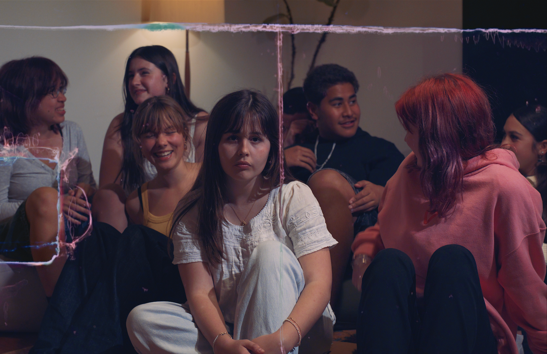 Group of young people gathered informally together, placing real social experience and individual presence at the centre of a campaign built around rangatahi speaking for themselves.