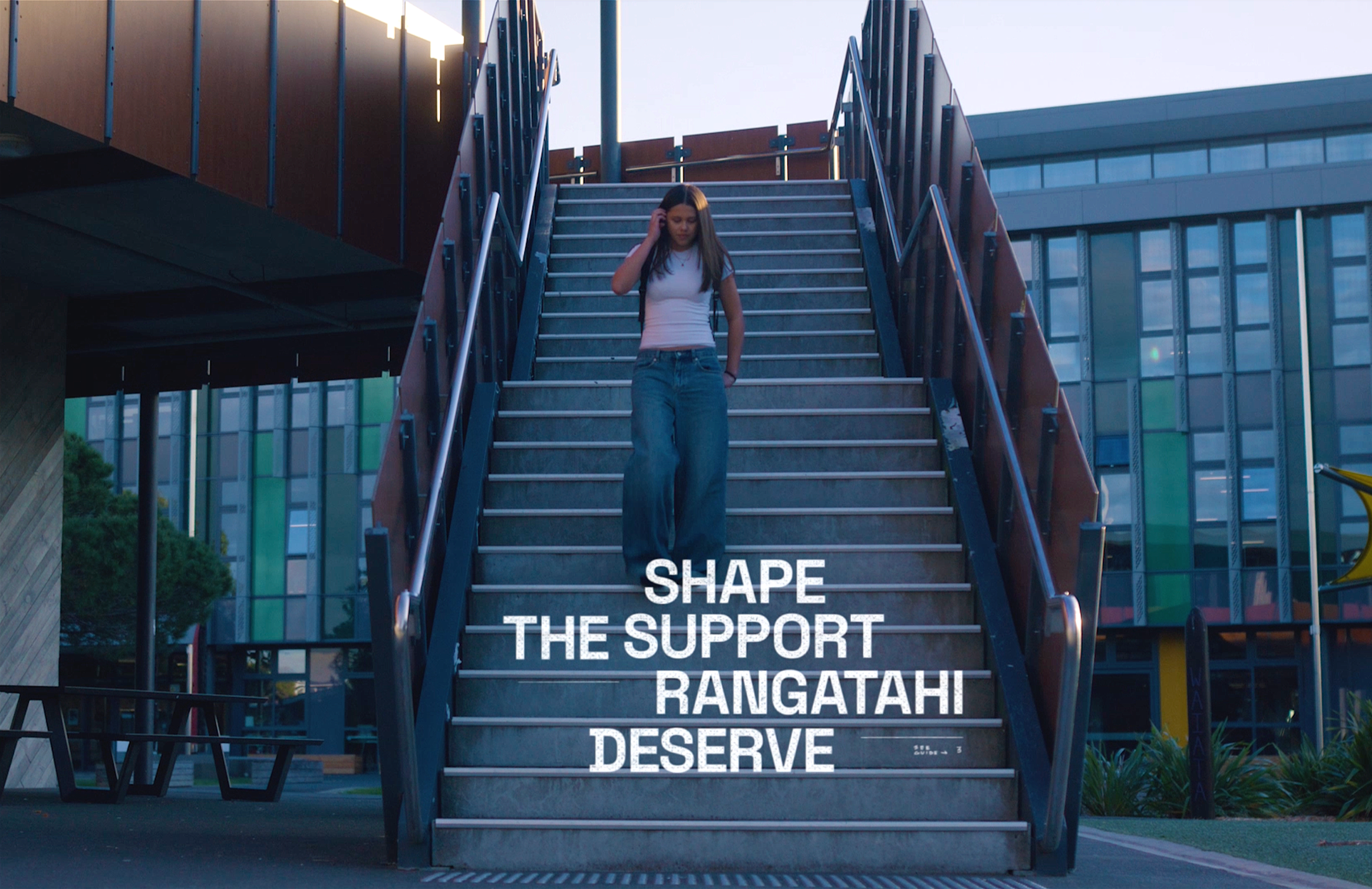 Young person descending outdoor stairs above the words “Shape the support rangatahi deserve”, connecting participation directly with what Youthline can learn and improve