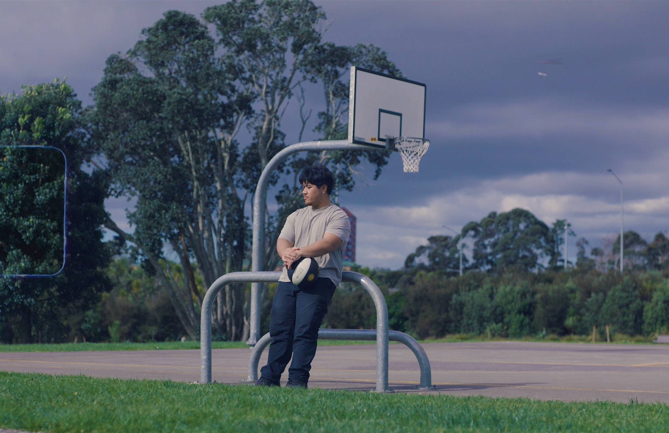 State of the Generation portrait of a young person beside an outdoor basketball court, situating the campaign in an everyday youth setting rather than the visual language of institutional research.