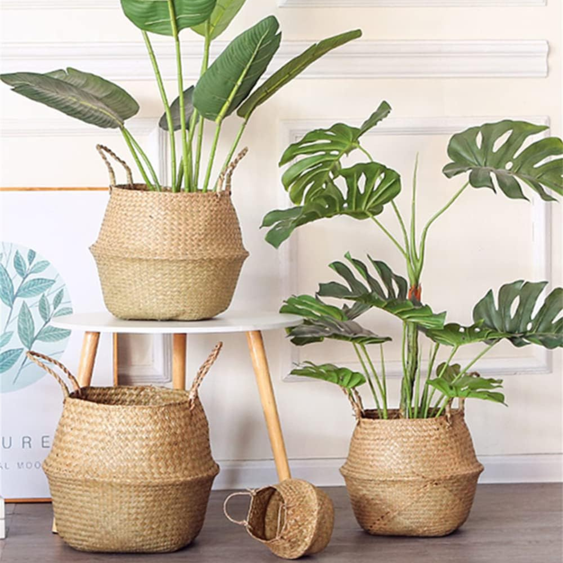 Handwoven seagrass storage basket with handles styled in a living room corner — natural home storage from The Alcove Edit