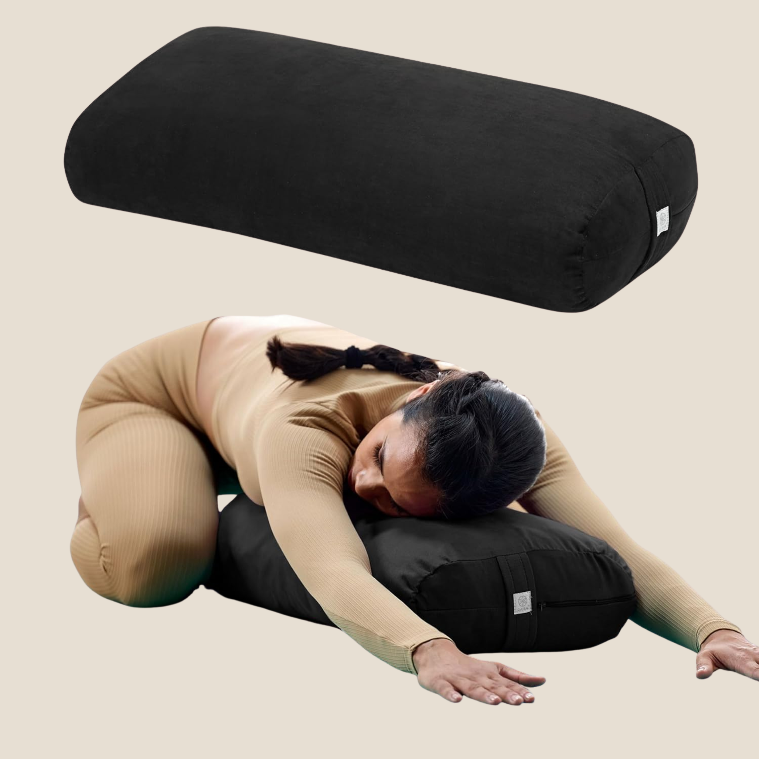 Gaiam yoga bolster pillow in black shown as a product shot above a woman in a tan ribbed set folded forward over the bolster in child's pose
