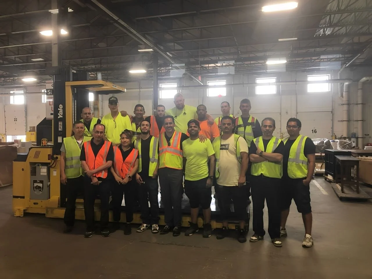 DNA Logistix warehouse operations team at a national distribution facility, representing the 600+ associates delivering warehousing, transportation, and dedicated fleet services for customers nationwide.