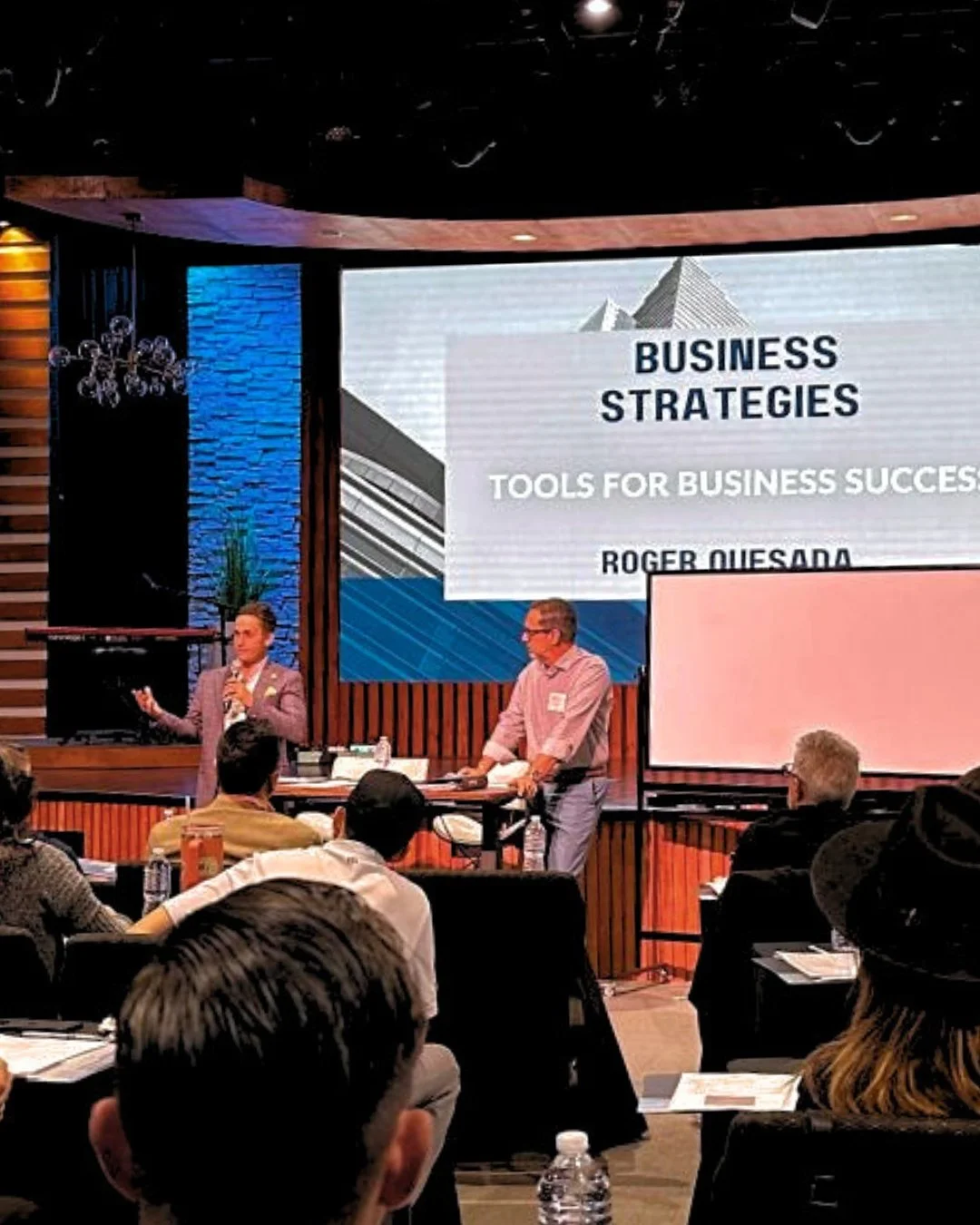 DNA Logistix President and CEO Roger Quesada presenting at a business strategies keynote, sharing leadership insights from a national third-party logistics company.