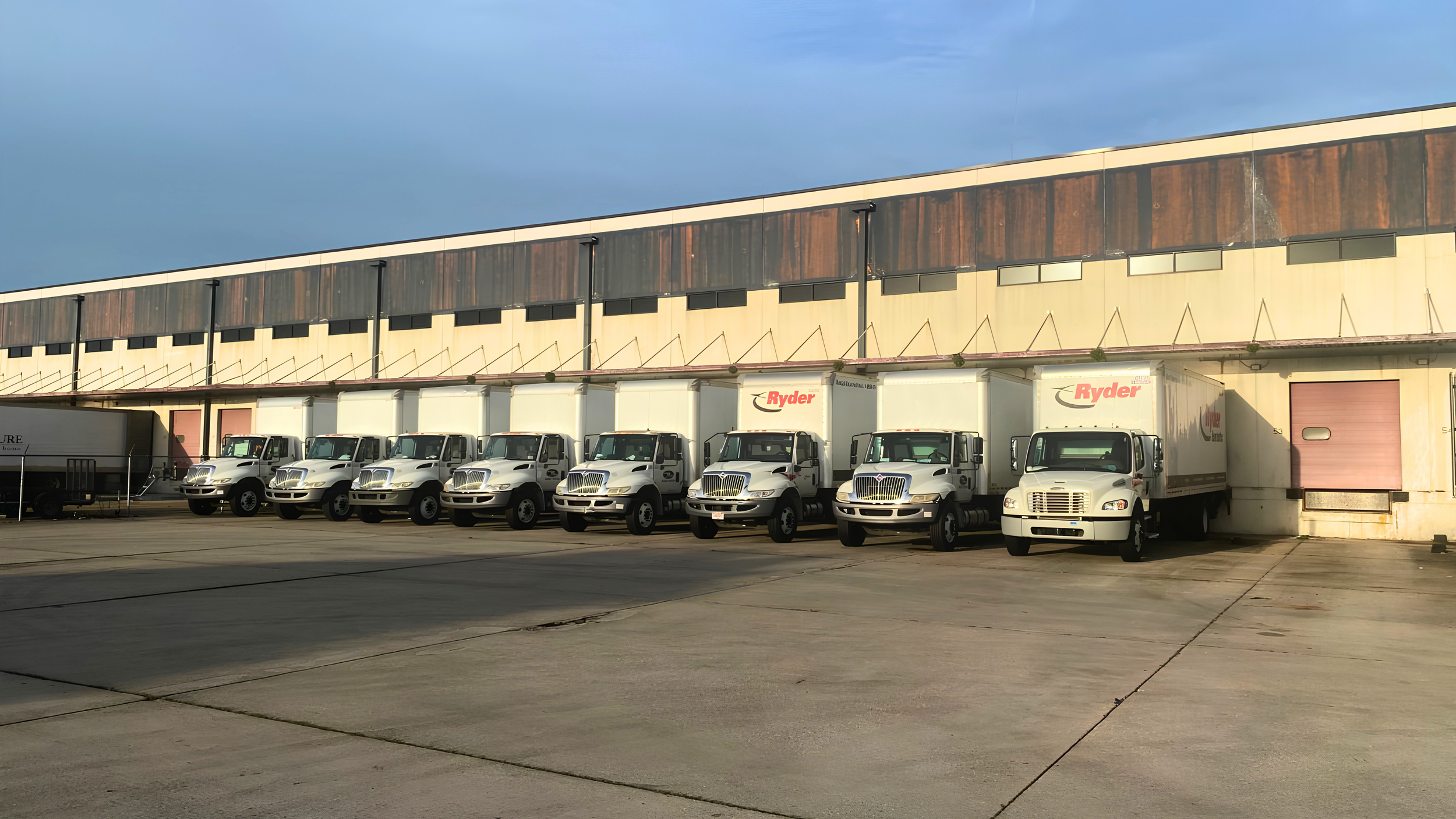 DNA Logistix transportation fleet staged at a national 3PL warehouse facility, ready for last-mile and dedicated delivery operations.